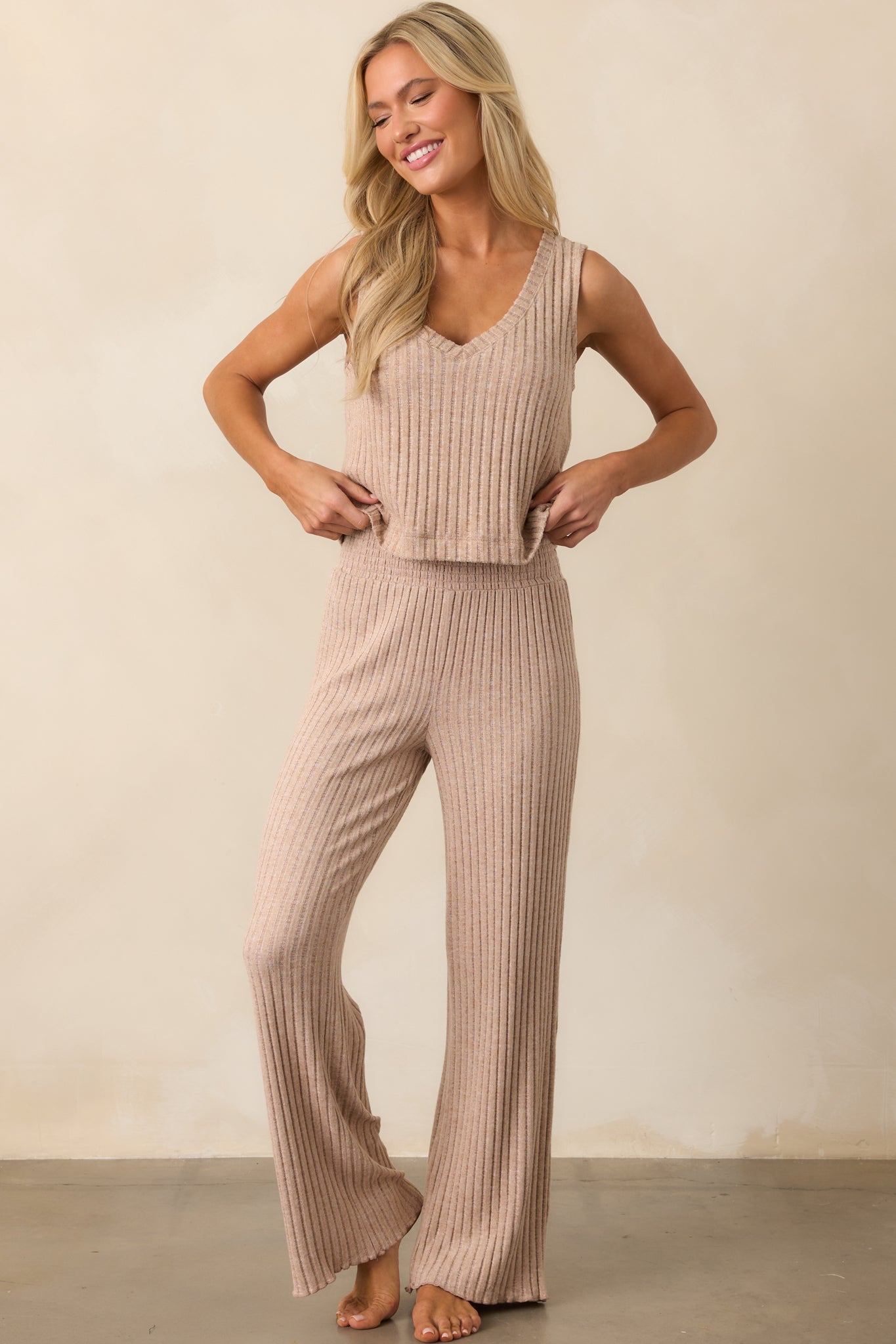 A full view of the coffee sleeveless top showcasing its v-neckline and wide, bra-friendly shoulder straps.