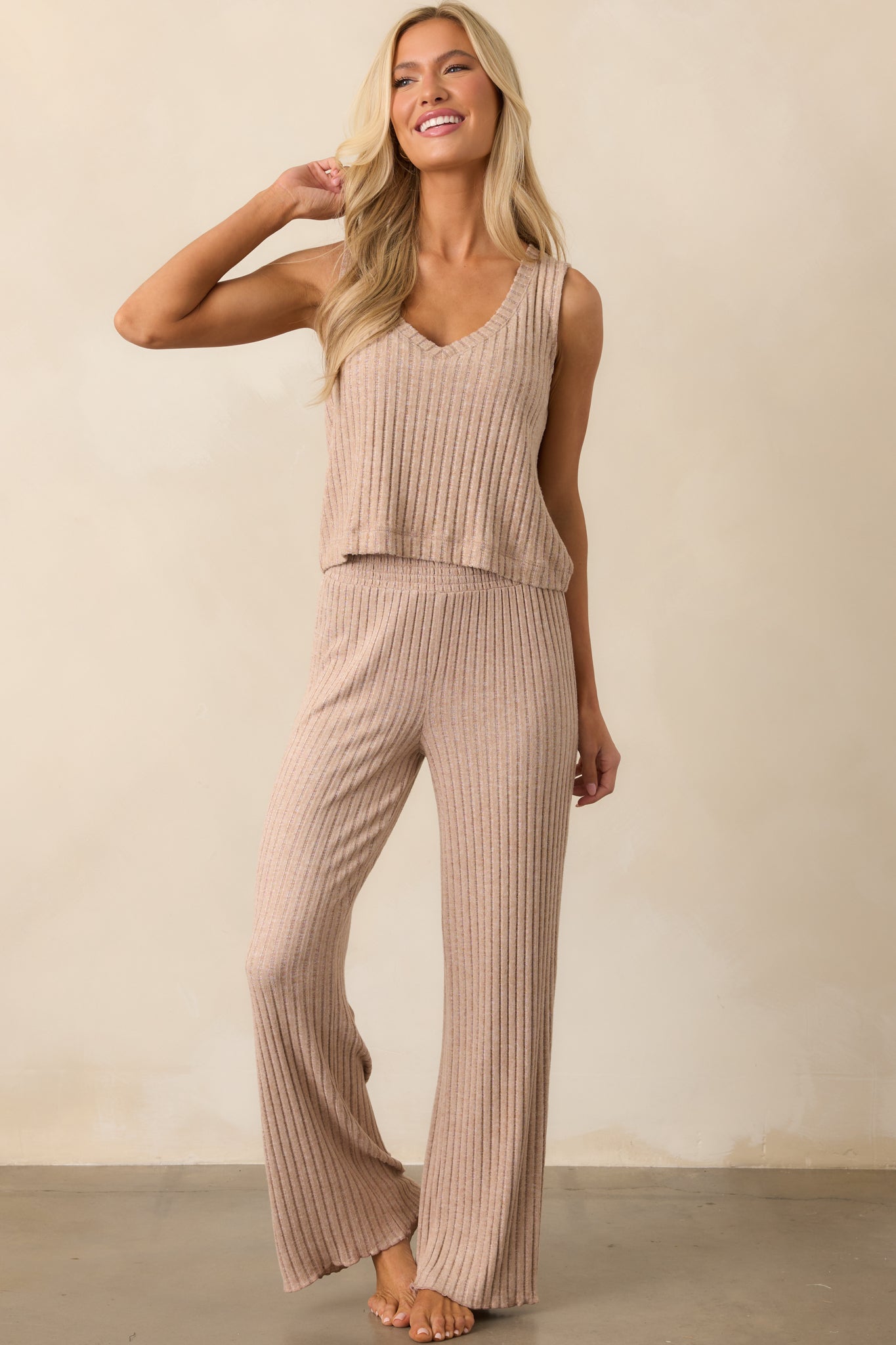 A full-length image highlighting the relaxed fit and soft ribbed texture of the coffee sleeveless top.