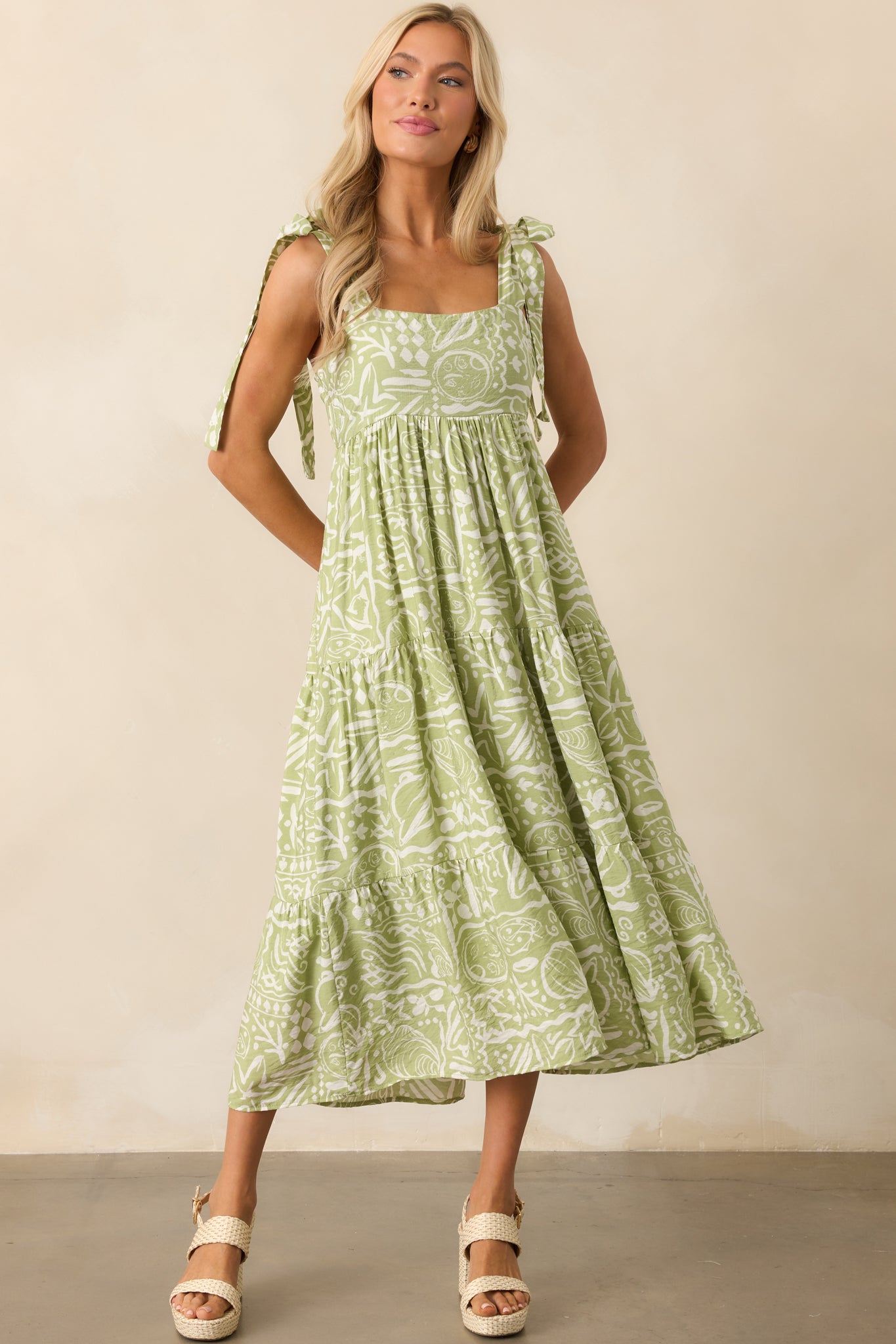 Green midi dress with a square neckline, tropical floral print, and tiered design for a relaxed fit.