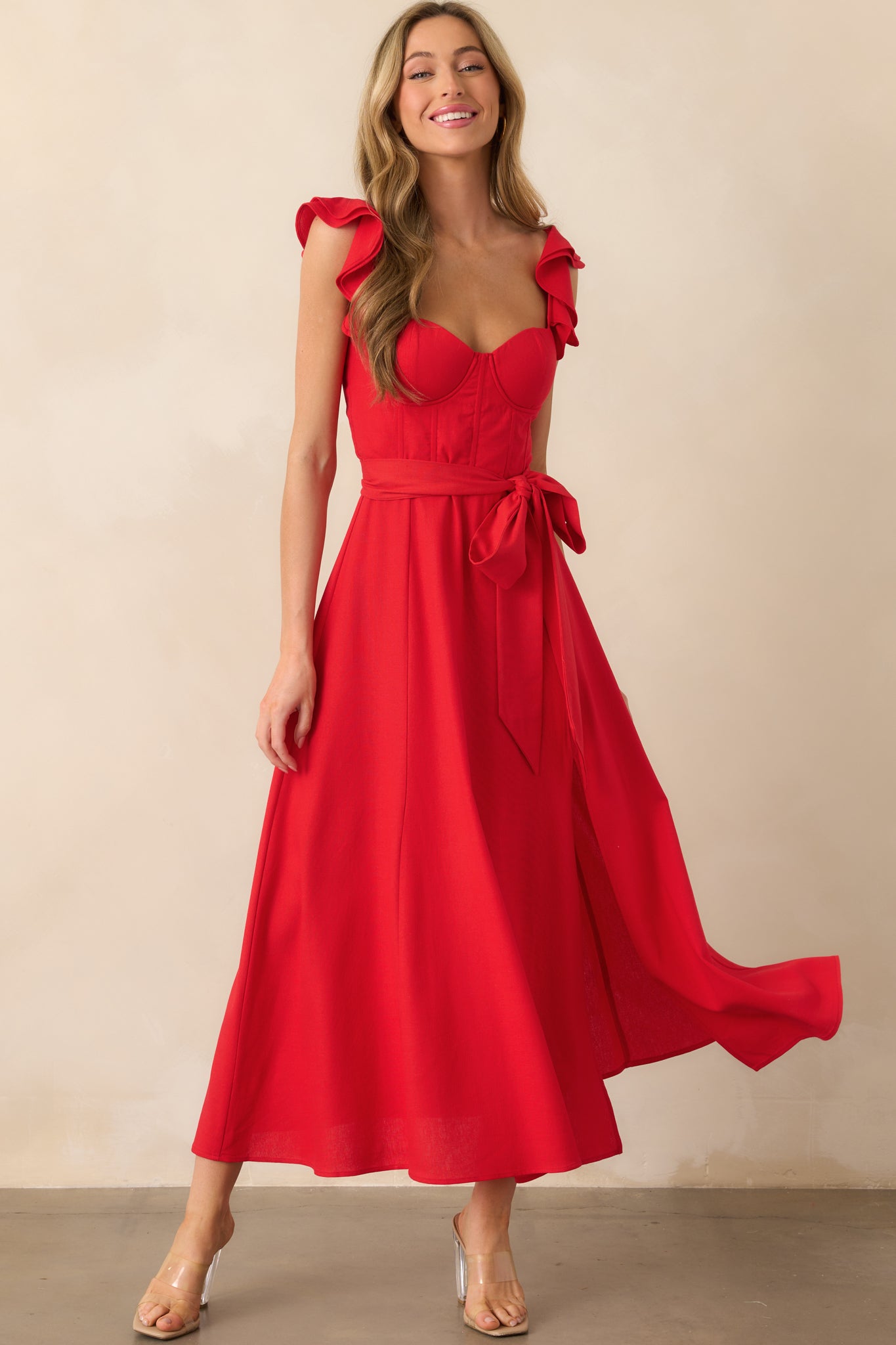 Full-length front view of the red maxi dress featuring a sweetheart neckline and structured bustier-style bodice.