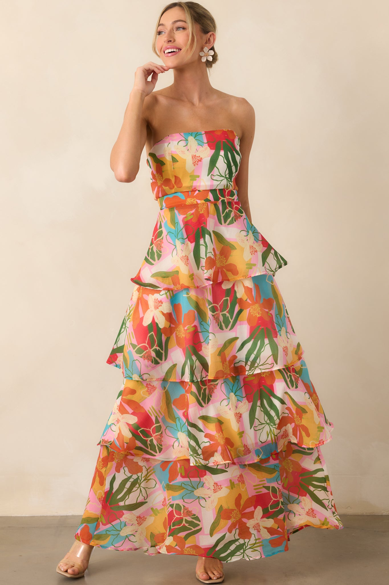 Full view of the strapless tropical print dress showcasing its vibrant colors and tiered ruffle skirt.