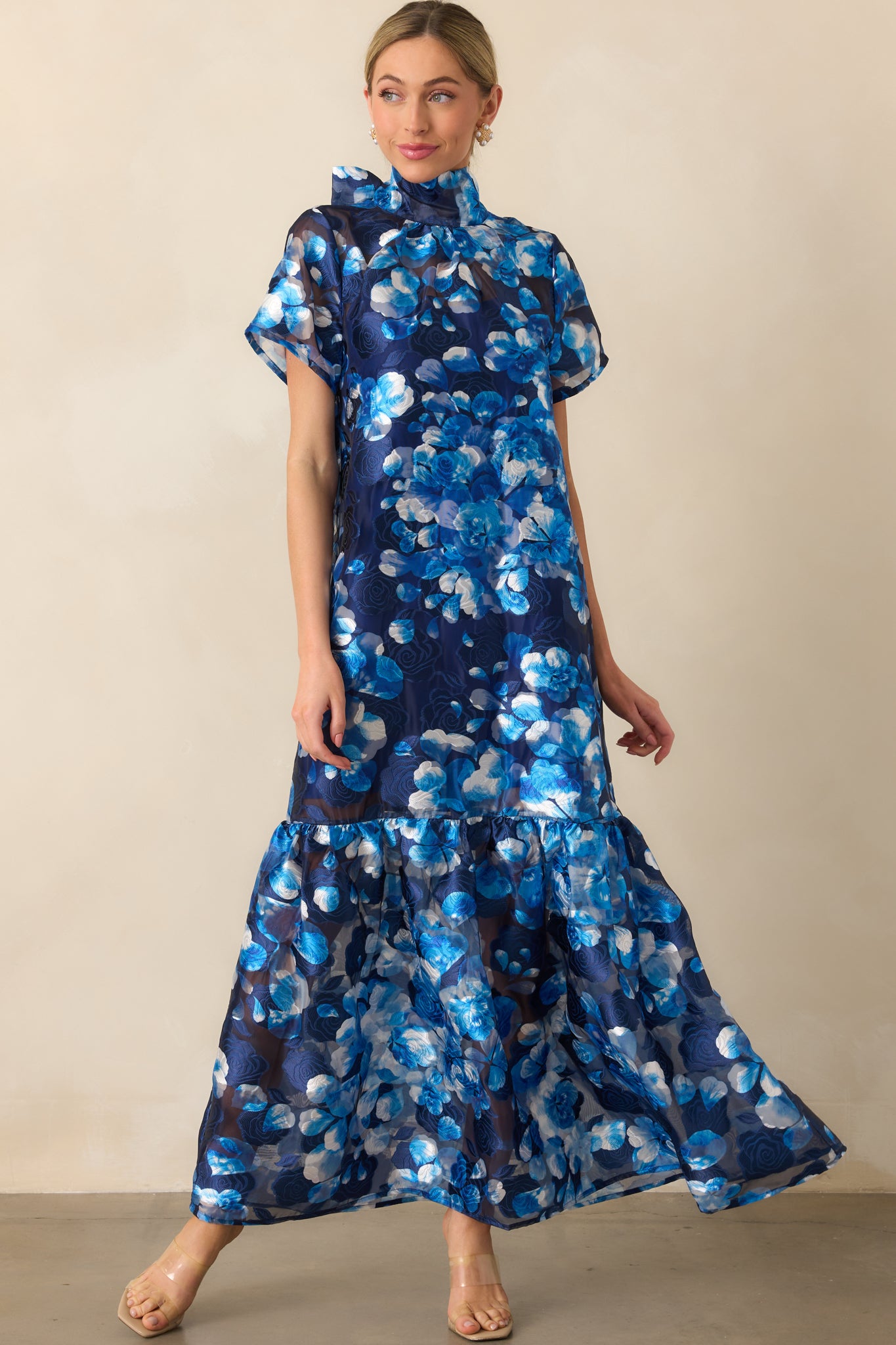 Front-facing image emphasizing the subtle volume of the short sleeves and the tiered flow of the hem.