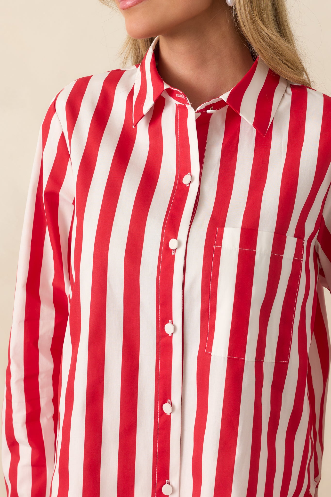 Close-up detail of the fabric and buttons, showing stripe precision and the soft shine of the buttons.