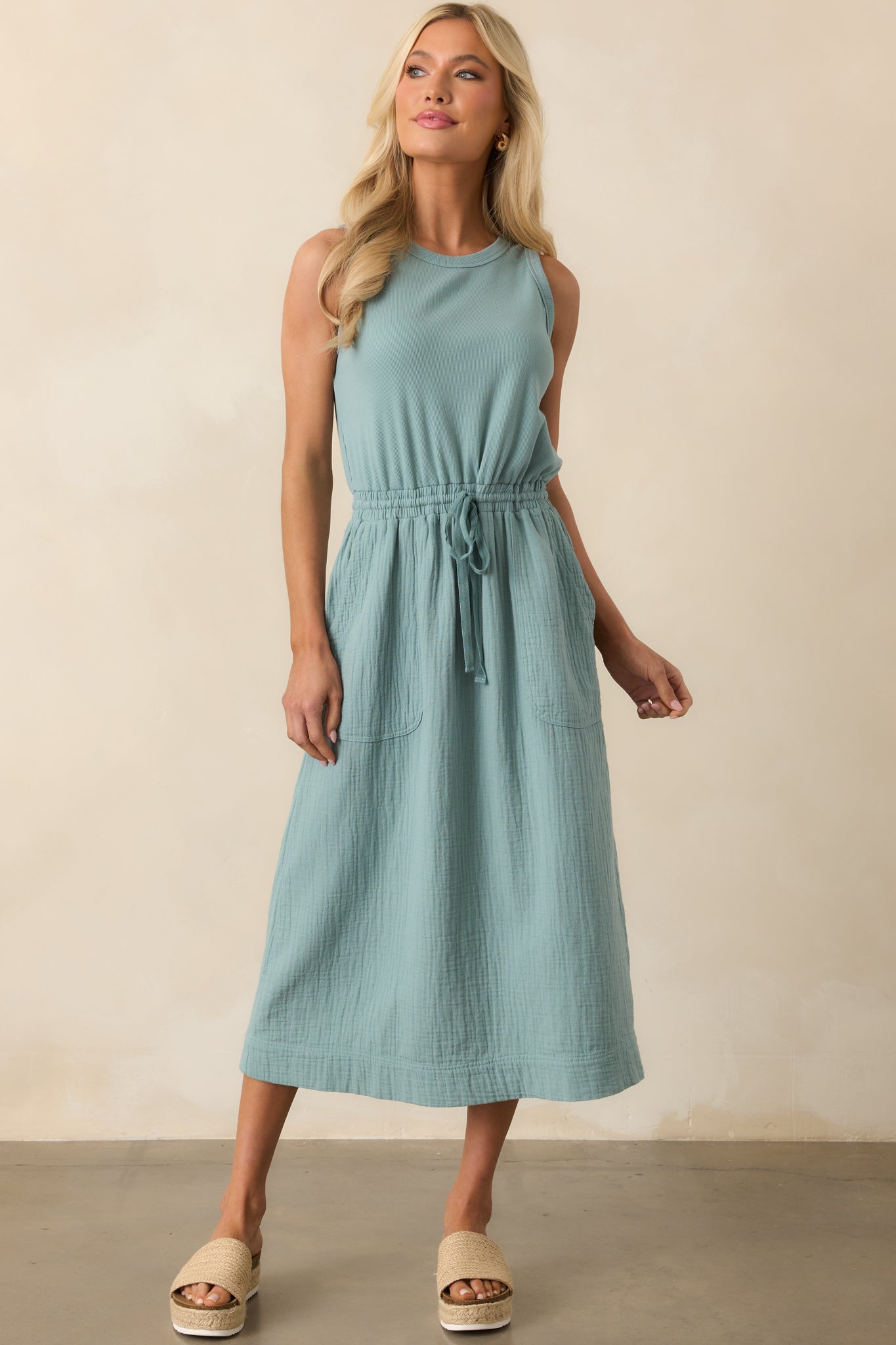 Front view of the midi dress with ribbed bodice, drawstring waist tie, and lightly gathered skirt.