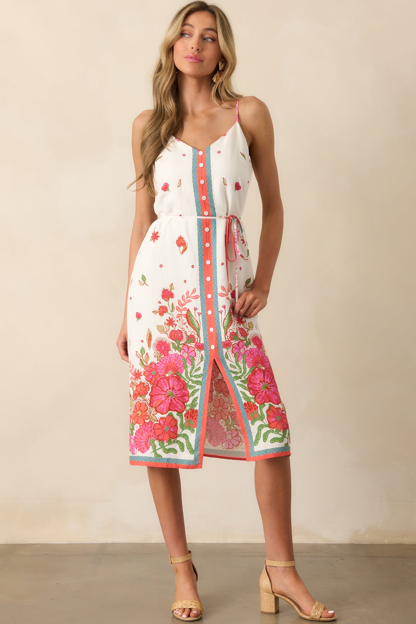 V-neck midi dress in magenta with a belted waist and soft drape, captured in a front-facing full body image.