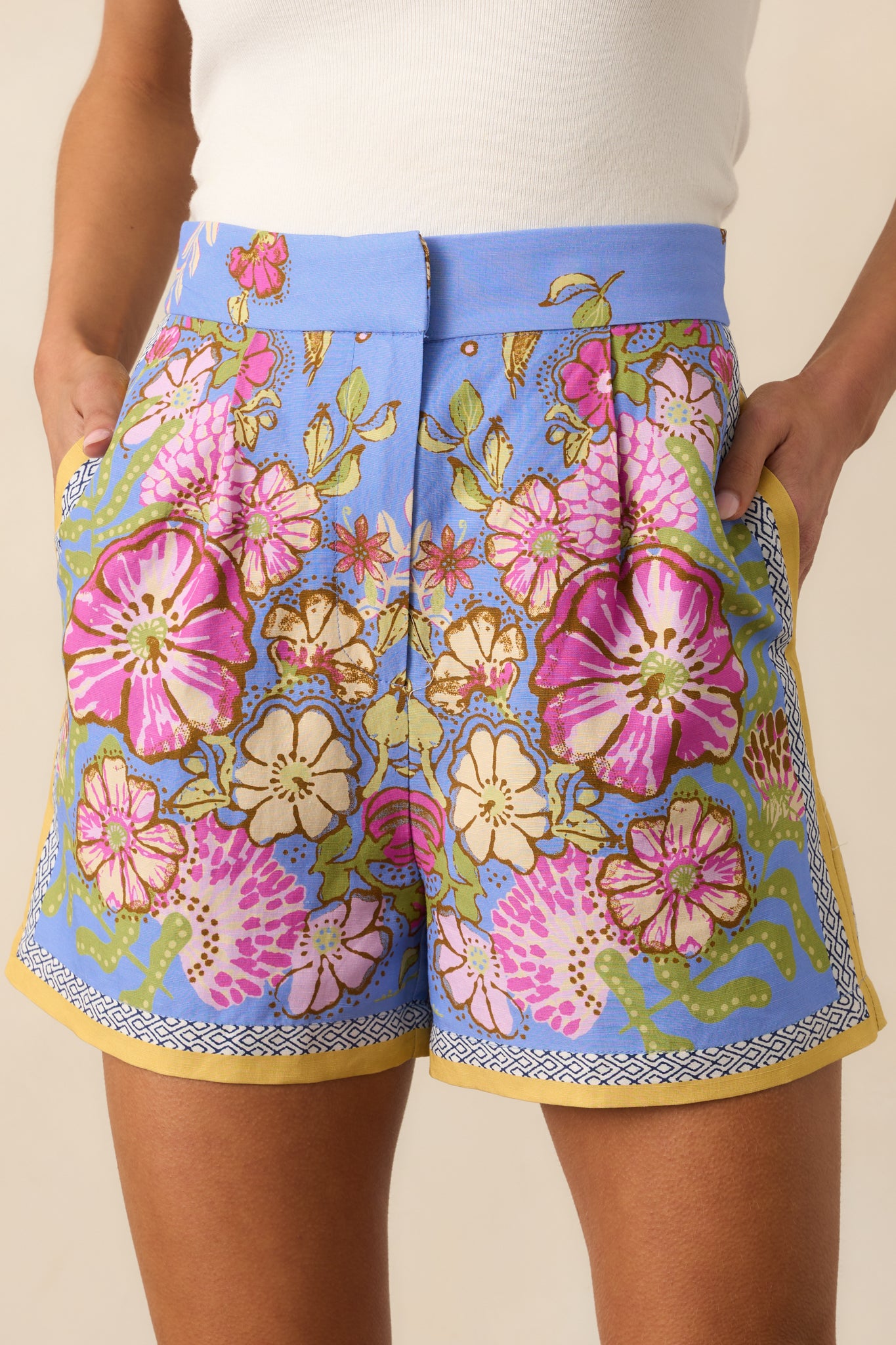 Focused view of the floral pattern on the shorts, showing the high waist design and pocket details.