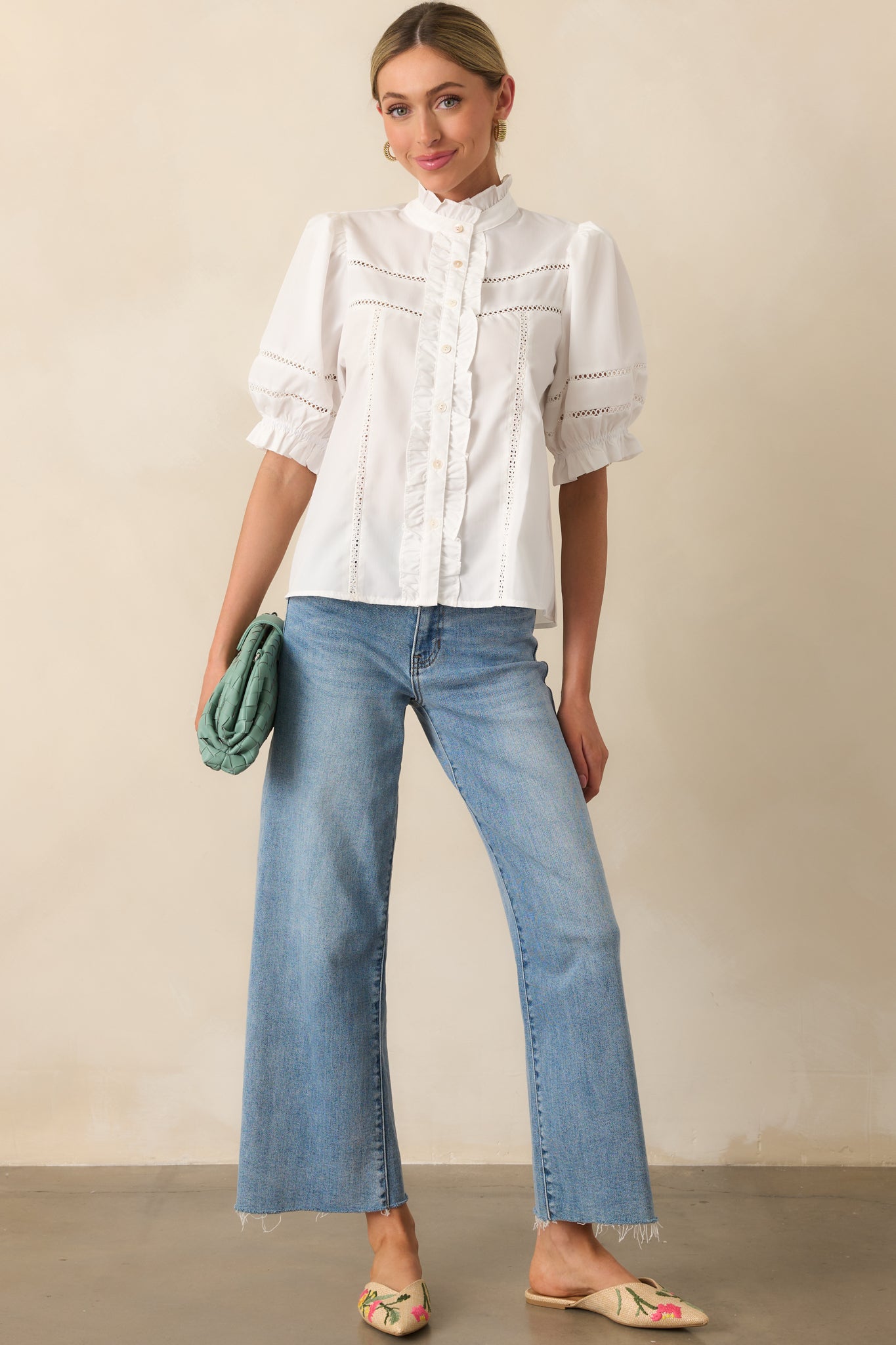 Relaxed fit ivory blouse shown in a full body view, emphasizing the vertical eyelet detailing and gentle drape.