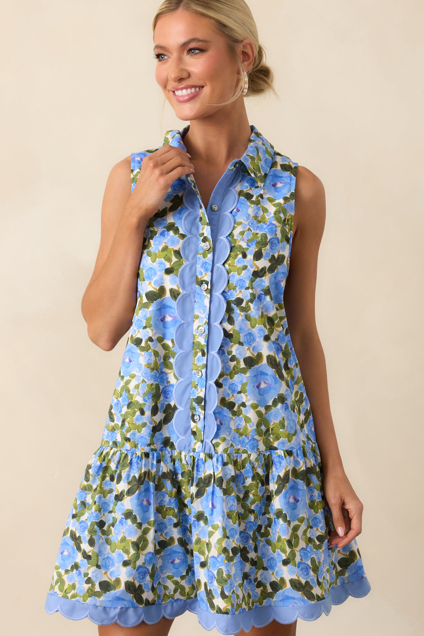 Cropped full-length view of the blue mini dress, showing floral pattern and relaxed silhouette.