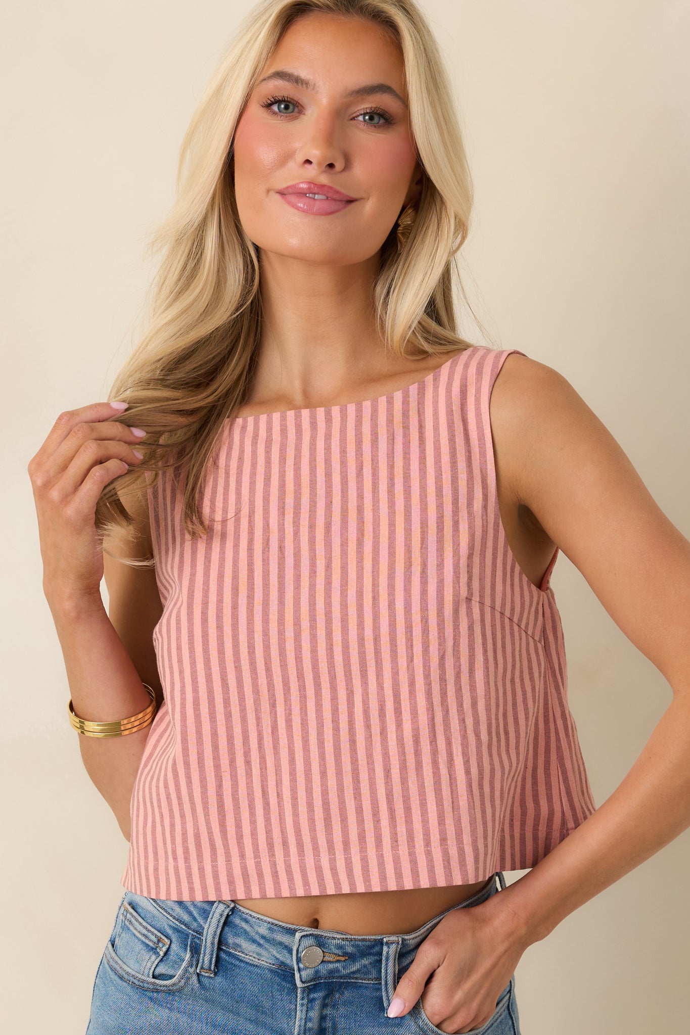Close crop of cotton linen top showing subtle stripe pattern and smooth front silhouette.