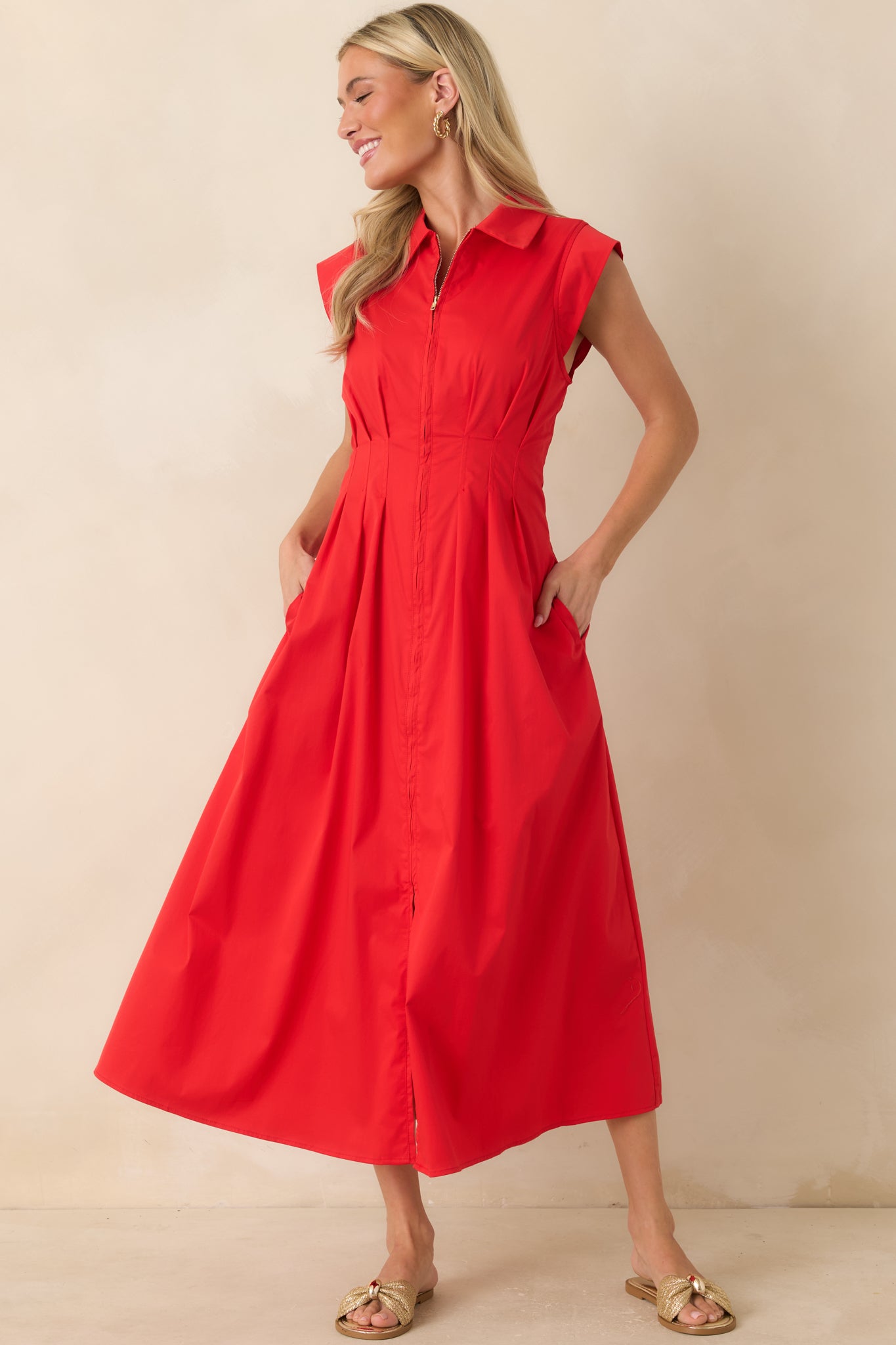 Feminine dress featuring a relaxed yet refined silhouette with graceful drape and movement.