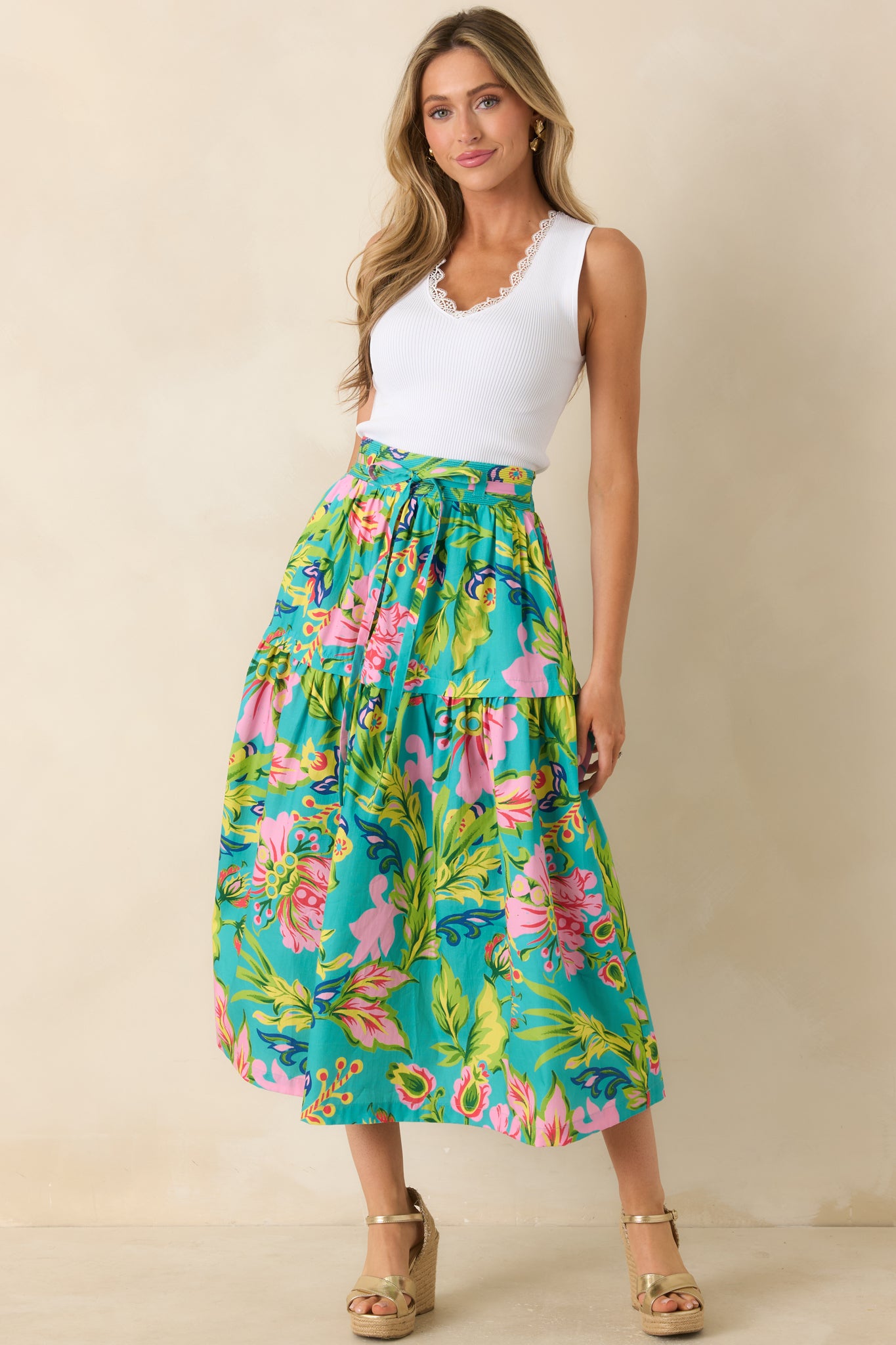 Jade tropical floral midi skirt featuring a tiered silhouette, elastic waistband, and flowy midi-length hem.