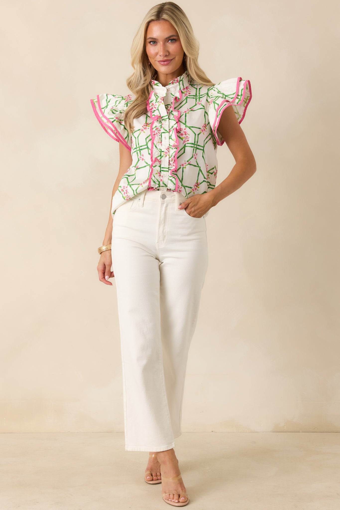 Pink and green trellis print blouse with a ruffled front placket and airy cotton construction.