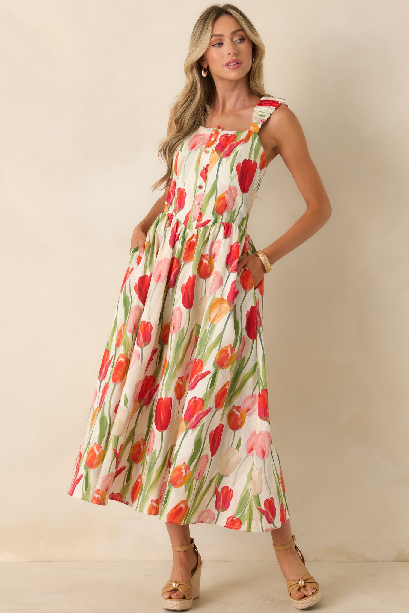 Ivory tulip print midi dress with a smocked elastic back panel, lightweight fabric, and soft flowing silhouette.