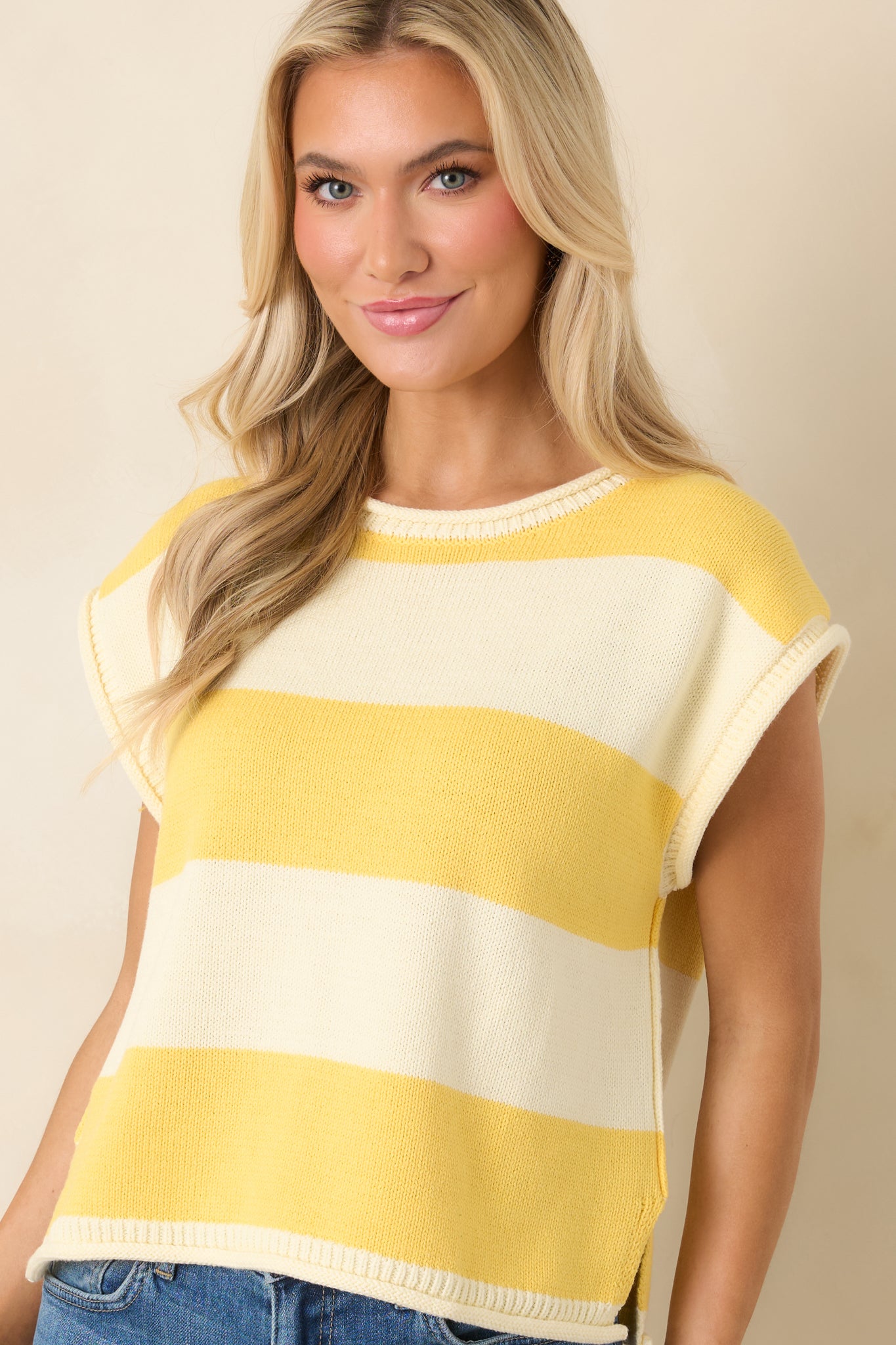 Round neckline detail with classic striped knit design.