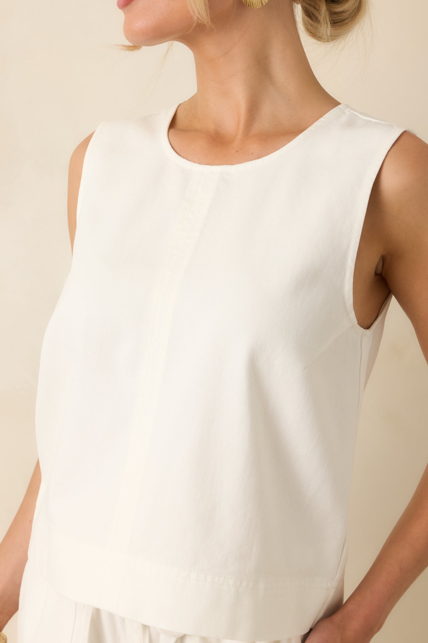 Close-up of the twill fabric showing its lightweight texture and refined seam construction along the bodice.