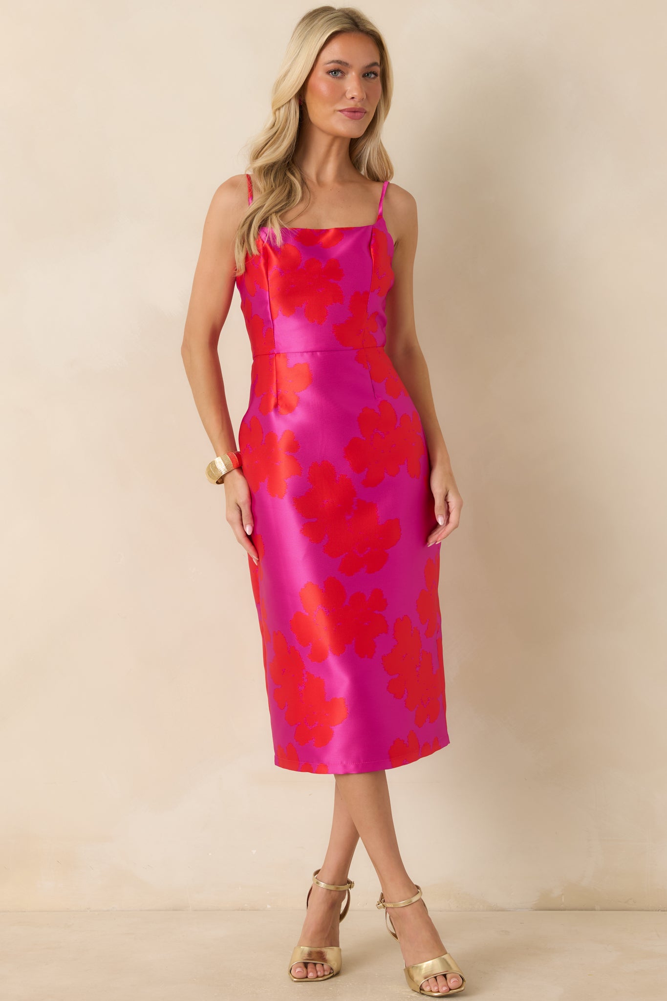 Fuchsia floral midi dress showcasing a fitted form, midi-length hem, and fully lined construction for smooth structure.