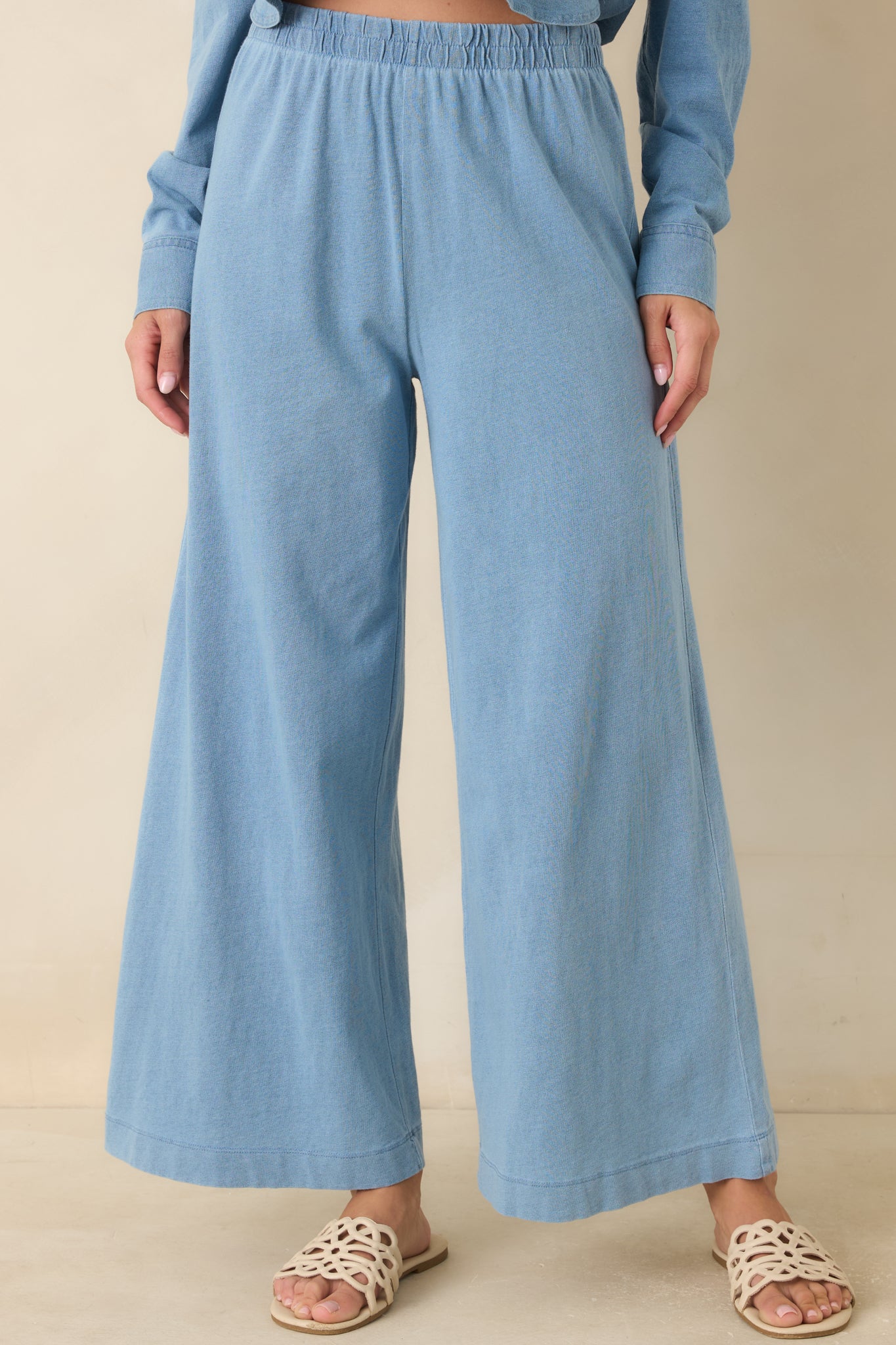 Black relaxed fit pants showcasing smooth fabric and comfortable everyday styling details.