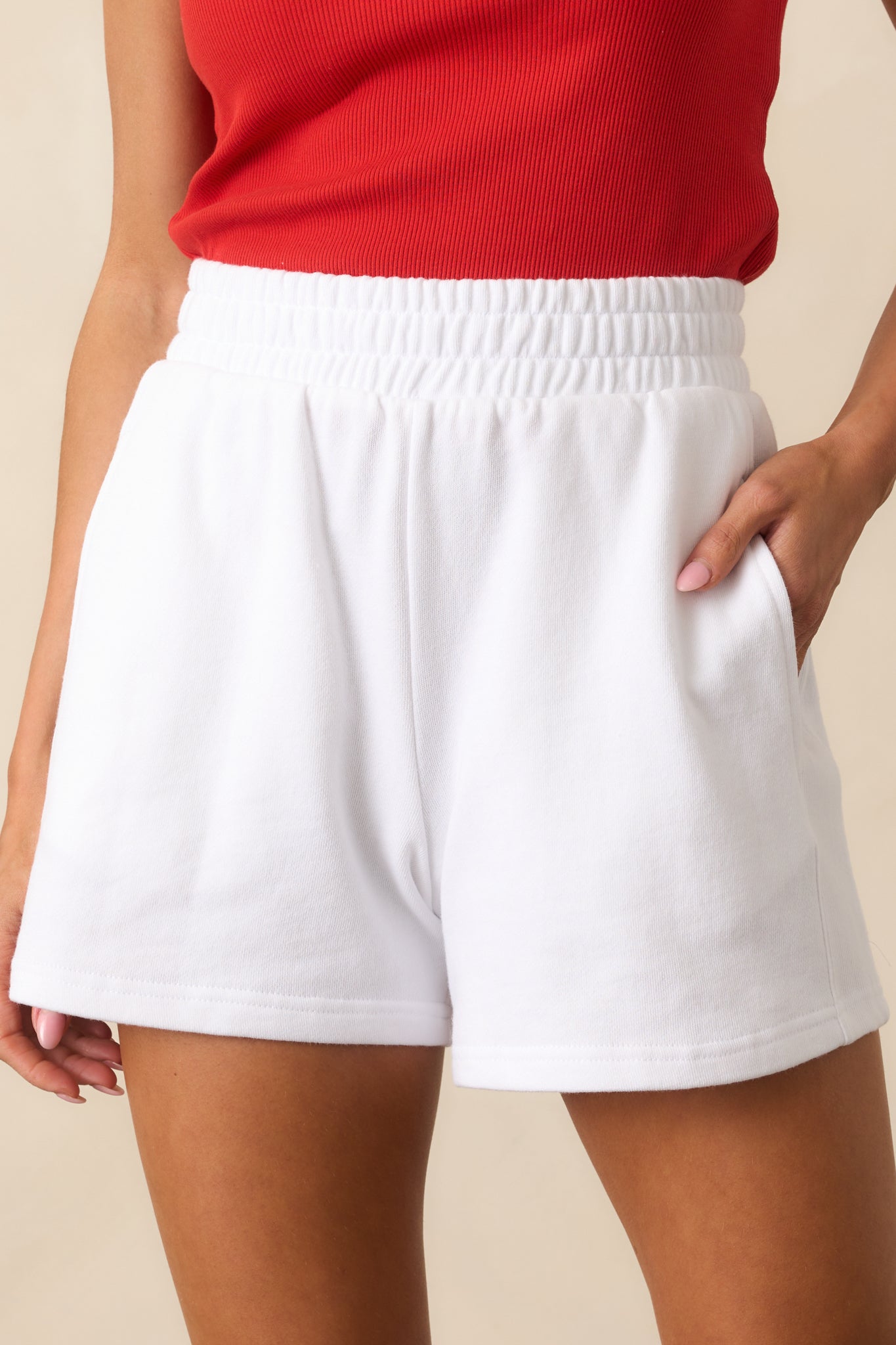 A zoomed-in shot of the soft cotton weave and stitching at the waistband and pocket edge.