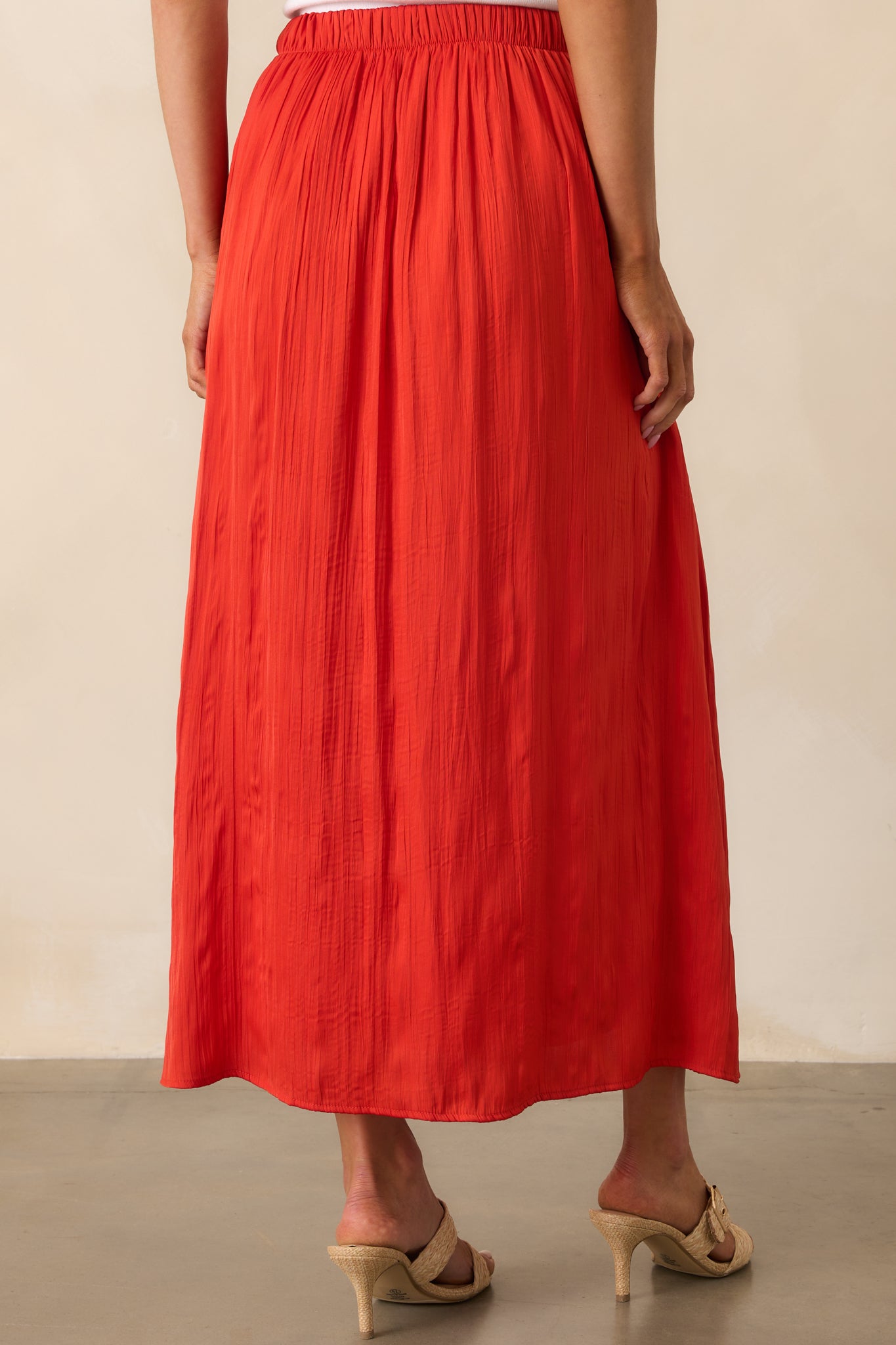 Rear view of the skirt, showing the elastic waistband and continued flowy silhouette from the back.