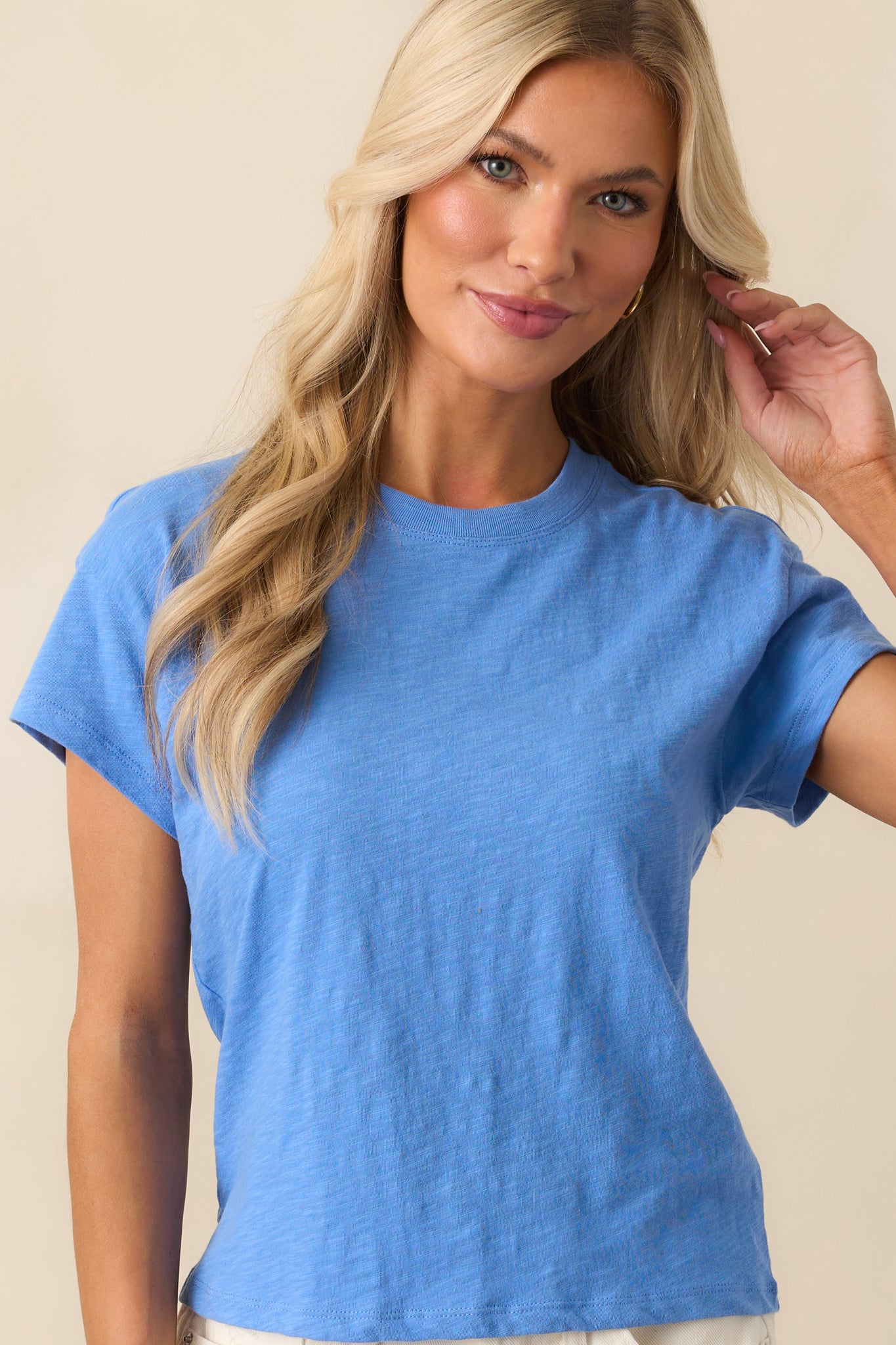 A close-up shot of the tee's neckline and shoulder seam detailing.