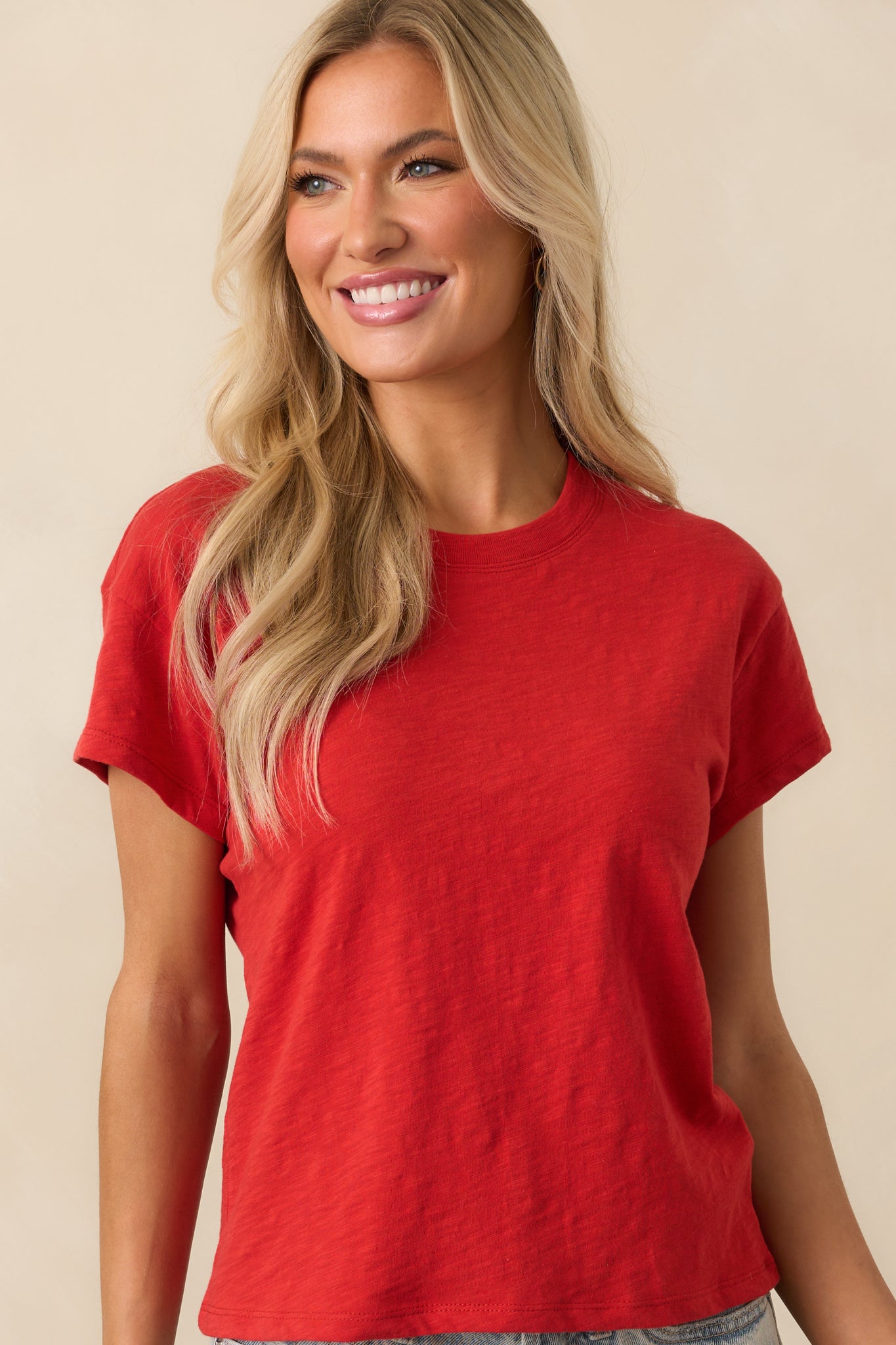 Cropped view of the red short-sleeve tee highlighting the lightweight fabric and fit at the chest.