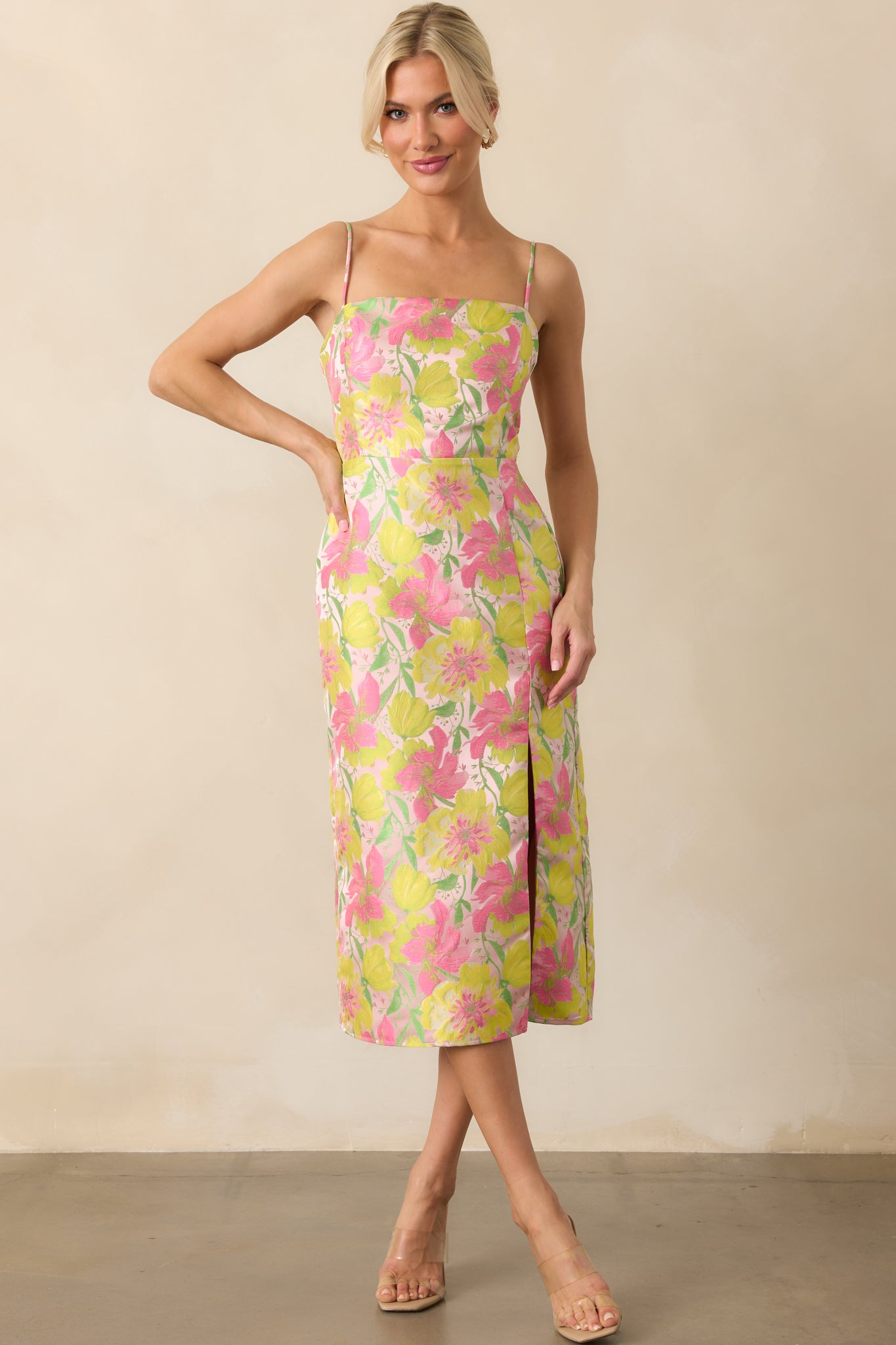 Full body front angle highlighting the leg slit and flowy silhouette, with floral print spread across the skirt.