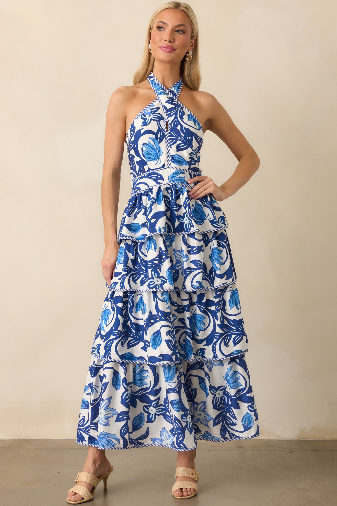 Straight-on full body image highlighting the tiered construction and how the floral print is distributed throughout the dress.