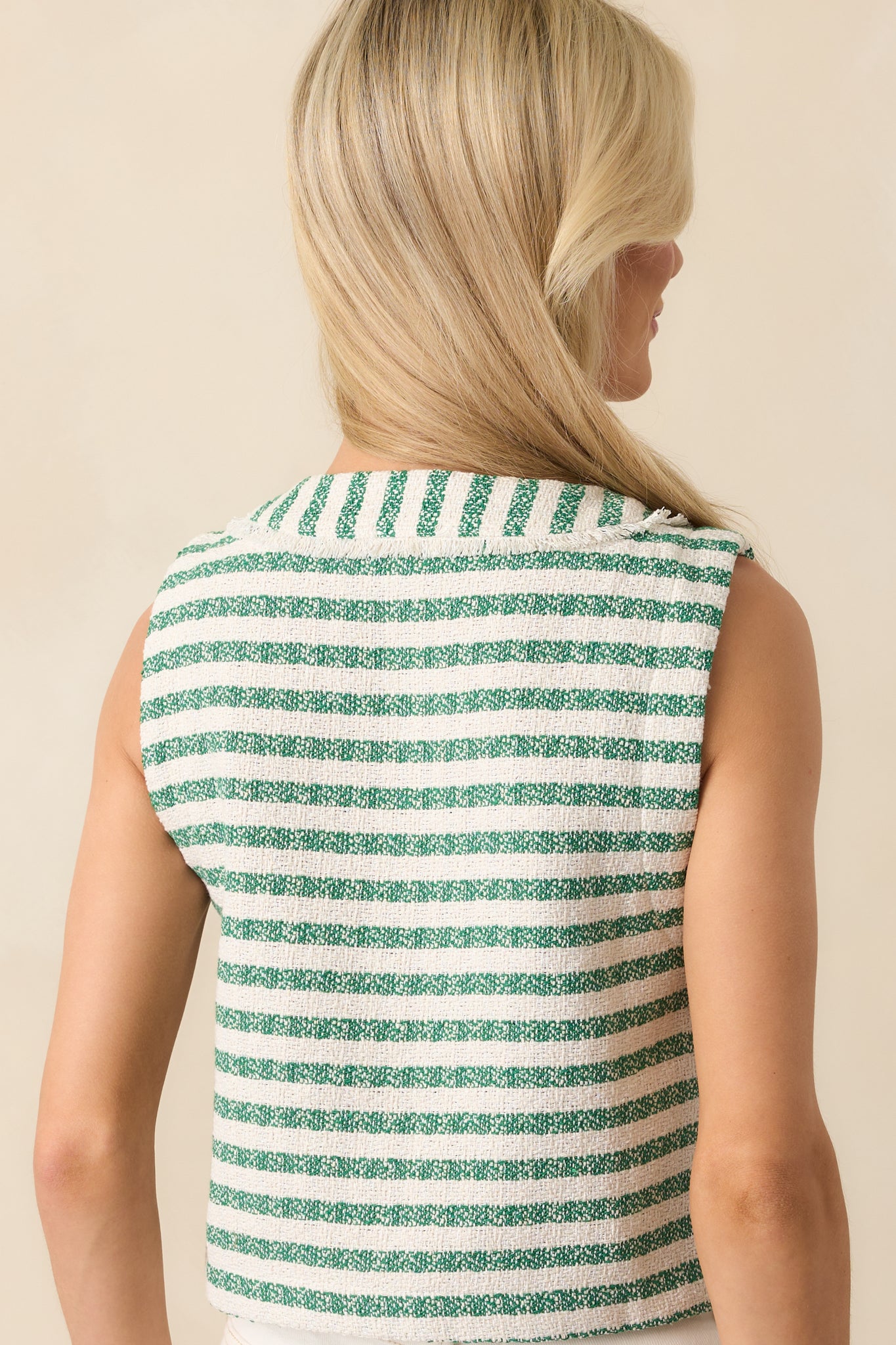 View from behind showing the continuation of the green and ivory stripe pattern and clean sleeveless back panel.
