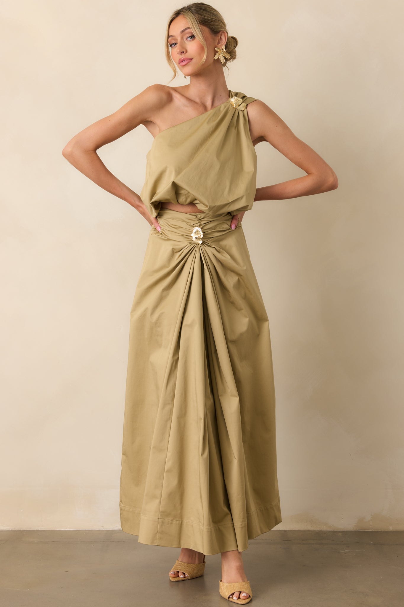 Full body angled view highlighting the 3D textured gold embellishment and the soft flow of the draped silhouette.