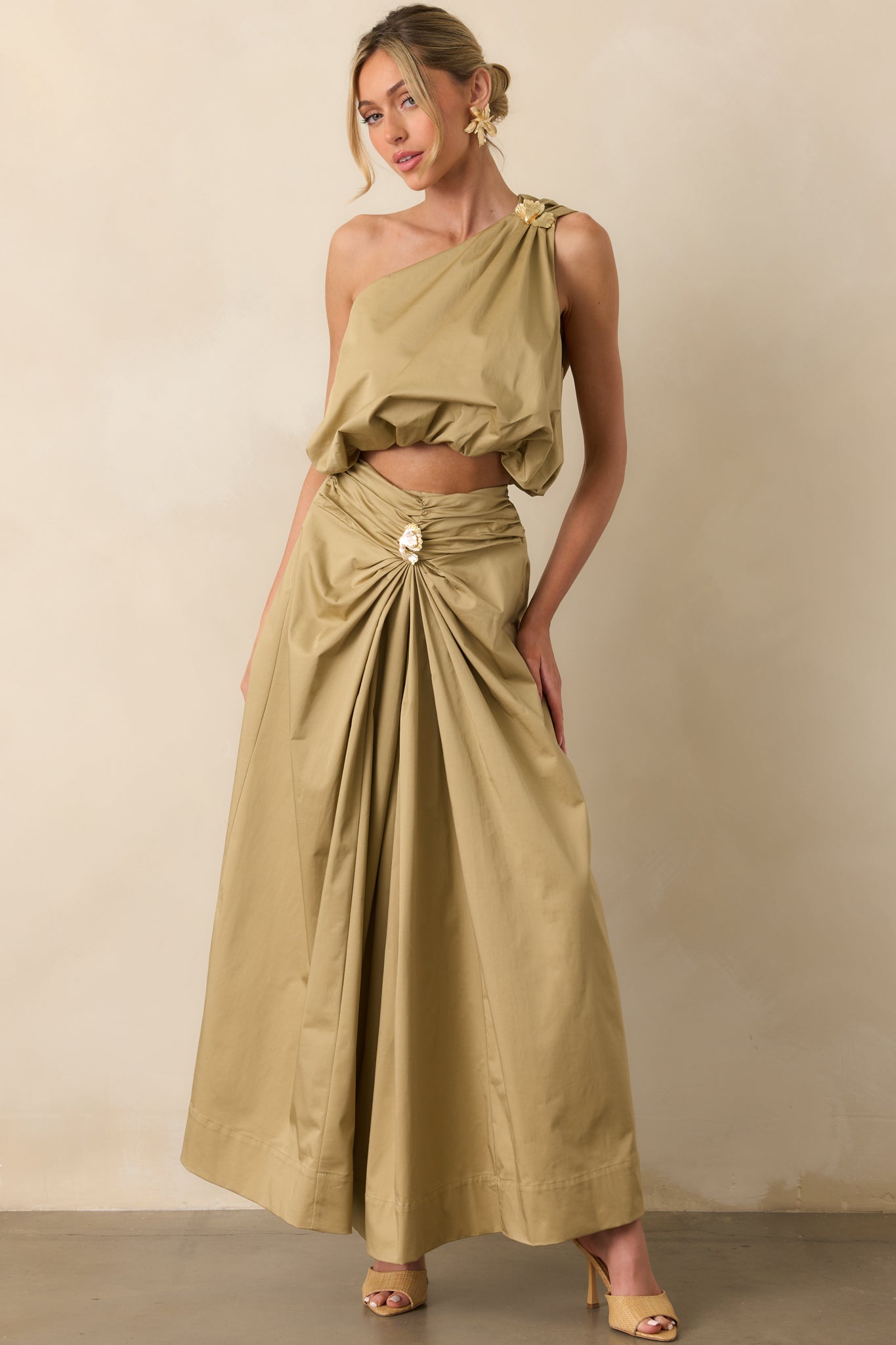 Full body front-facing pose emphasizing the high rise waist and the structured yet fluid shape of the skirt.