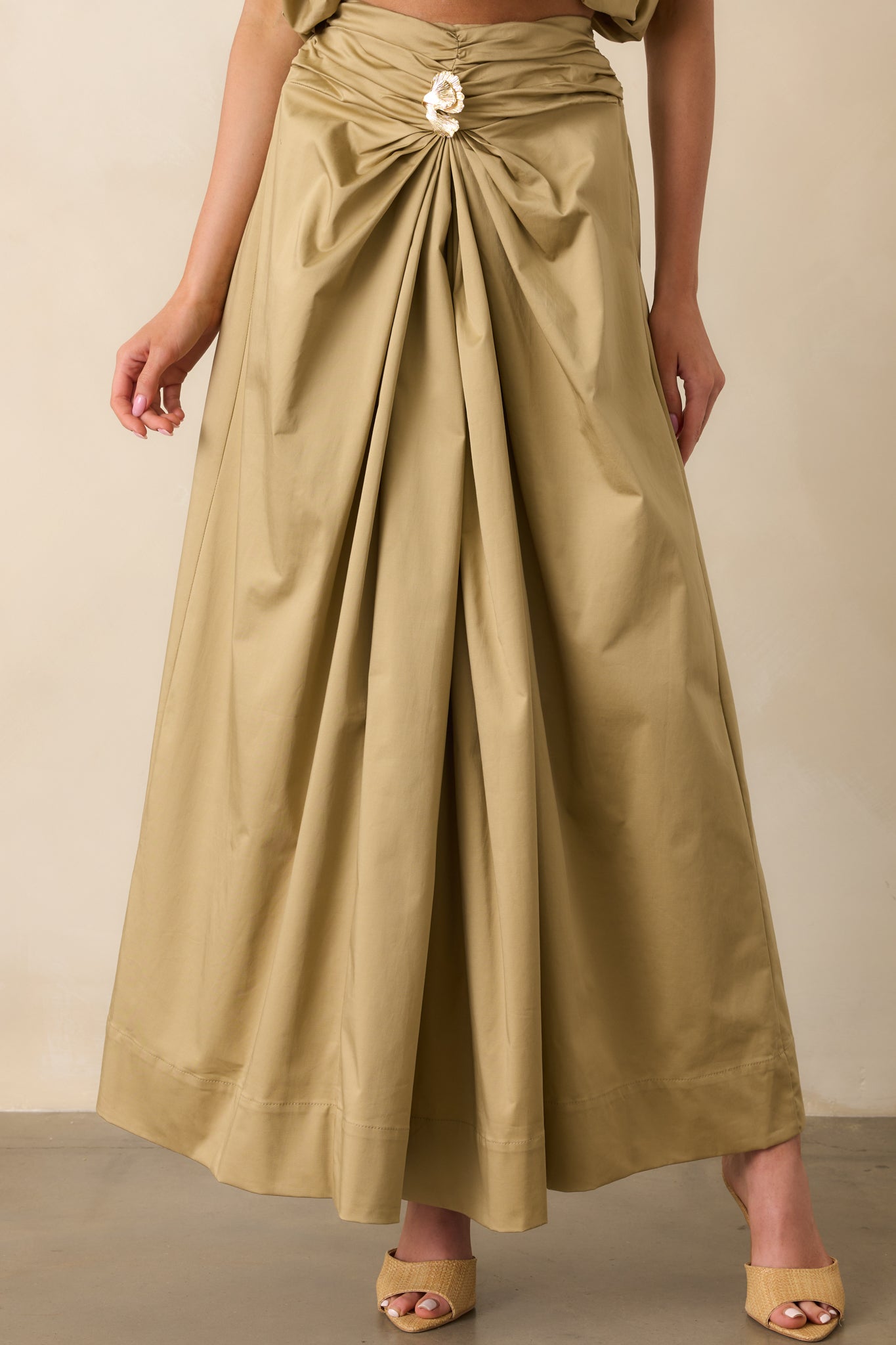 Cropped image of the lower portion of the skirt, highlighting the natural drape and movement of the maxi length.