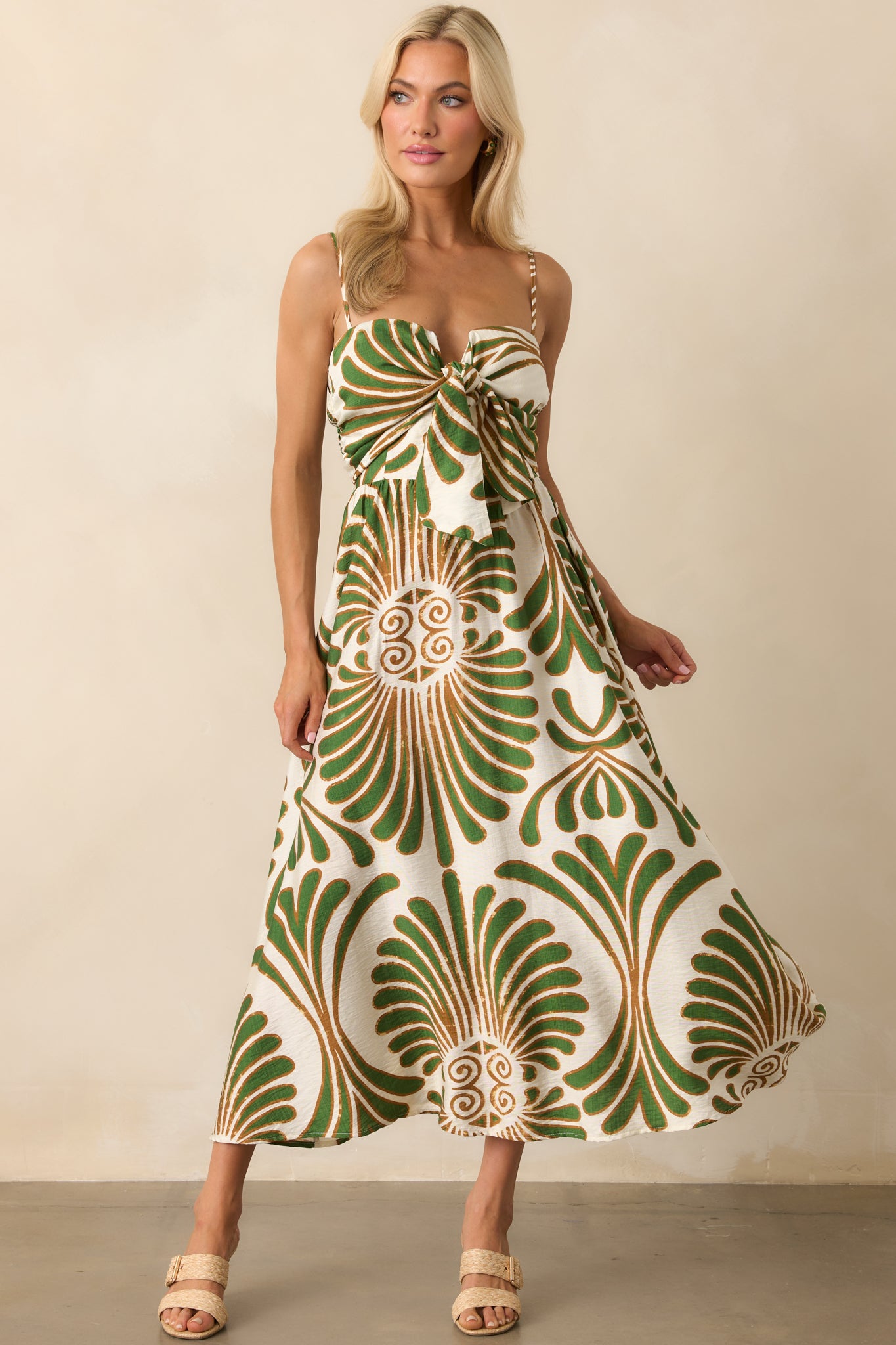 Full body front view with arms at sides, showcasing the smooth drape of the A-line skirt and vibrant print.