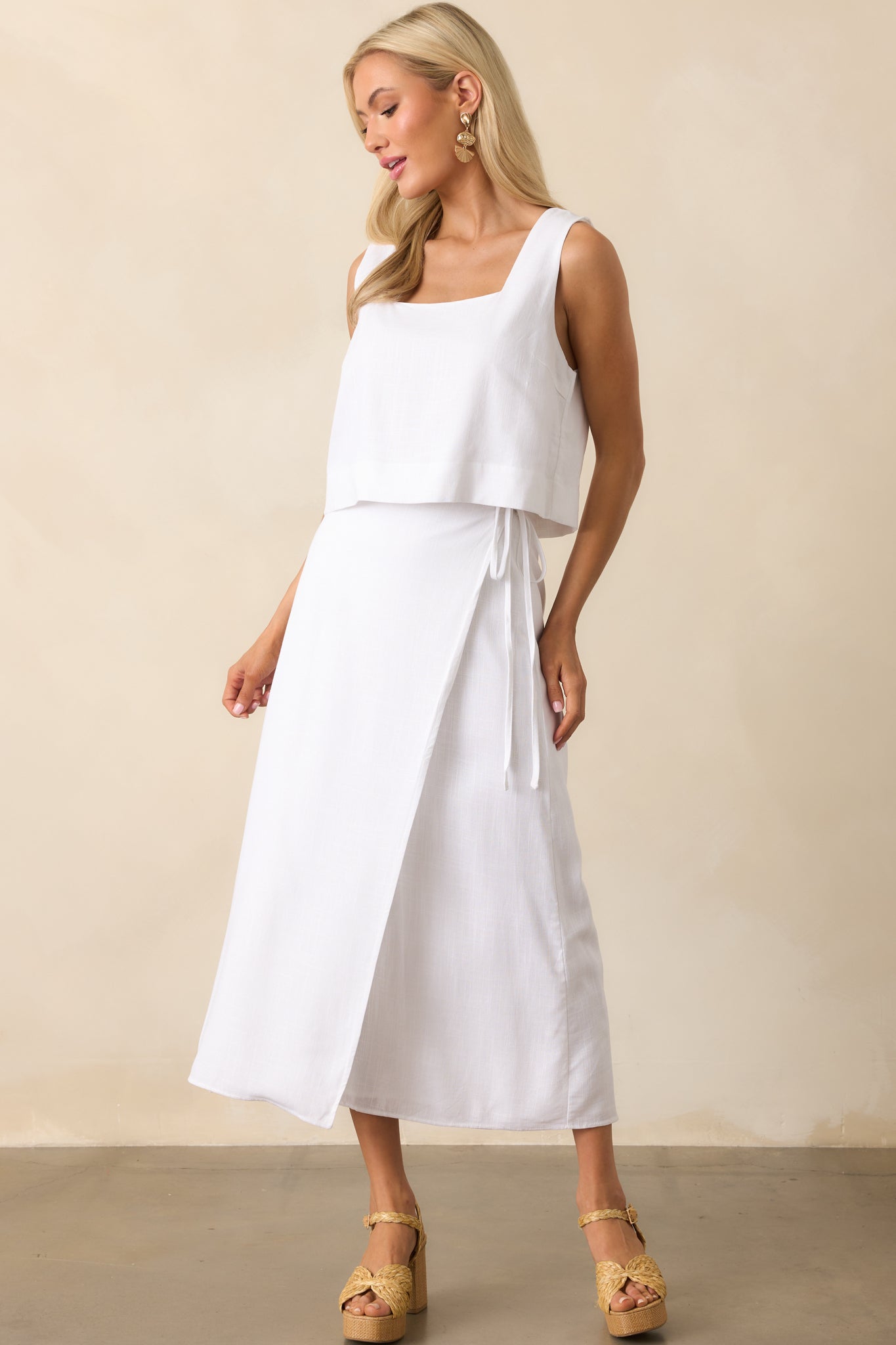 Full body angled view highlighting the relaxed fit and the way the wrap overlaps along the front of the skirt.