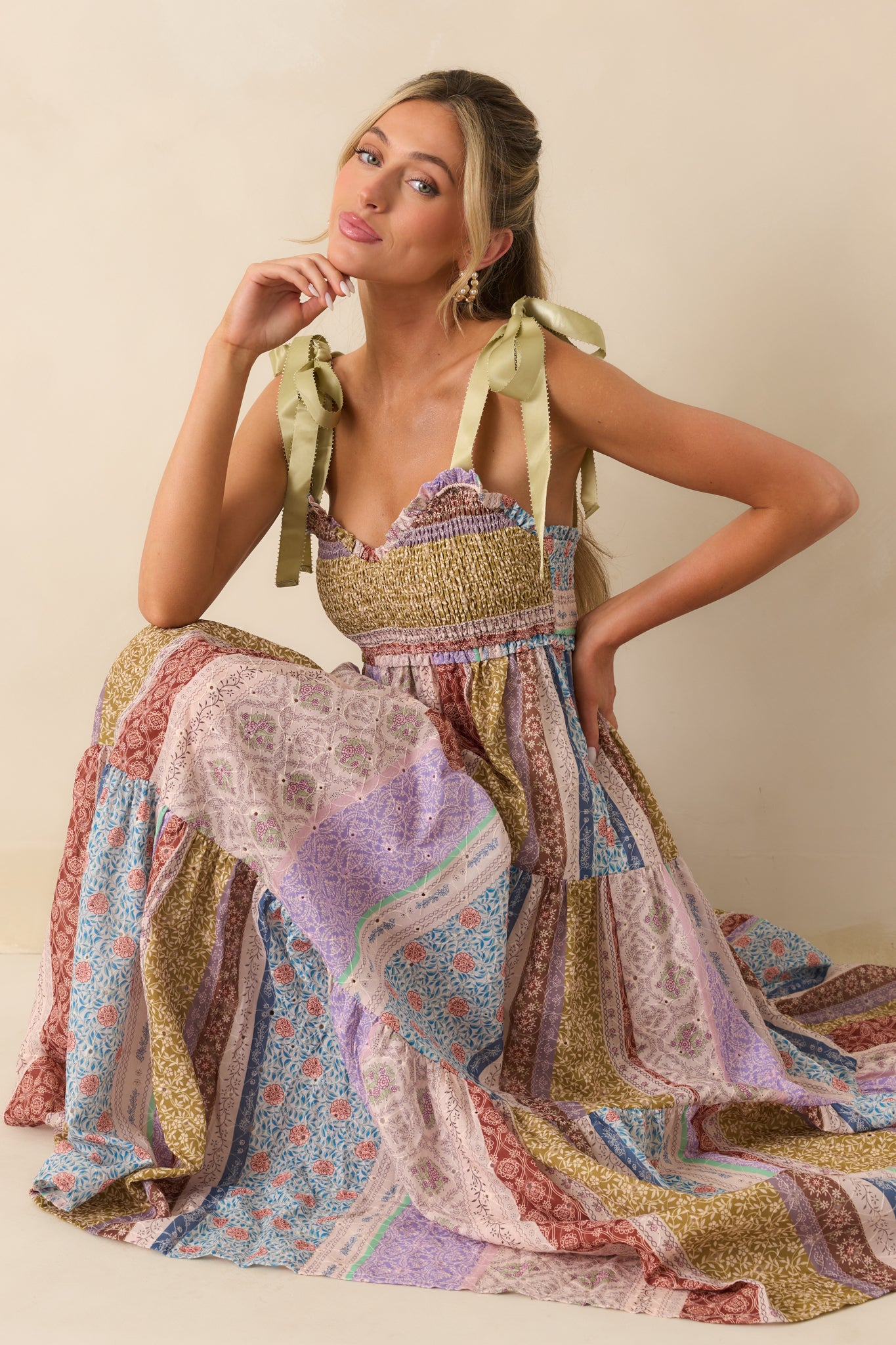 Front-facing image showcasing the sage green satin self-tie bow straps and subtle ivory eyelet embroidery.