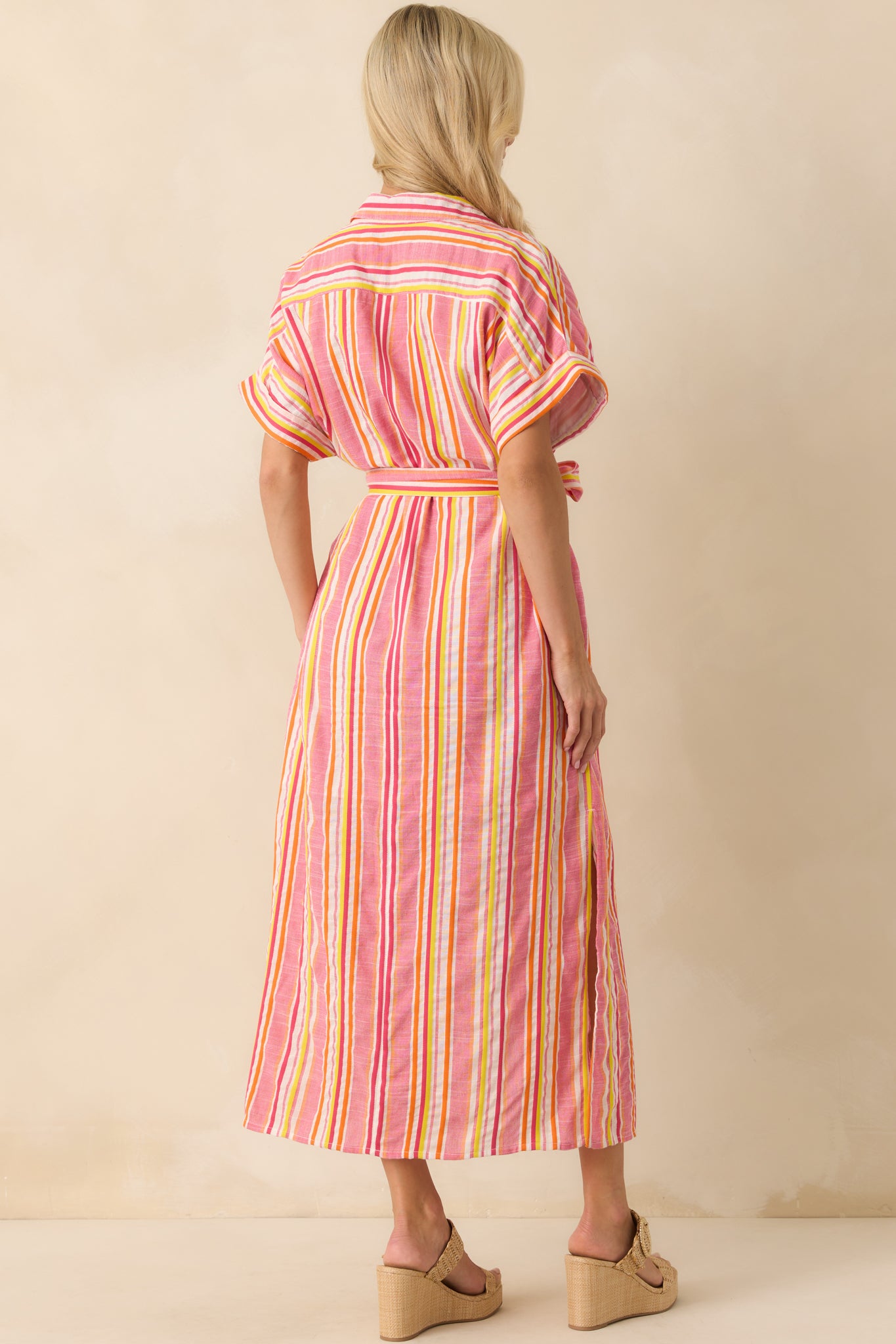 Back view of the dress highlighting the continuation of the stripe pattern, belt tied at the waist, and relaxed drape.