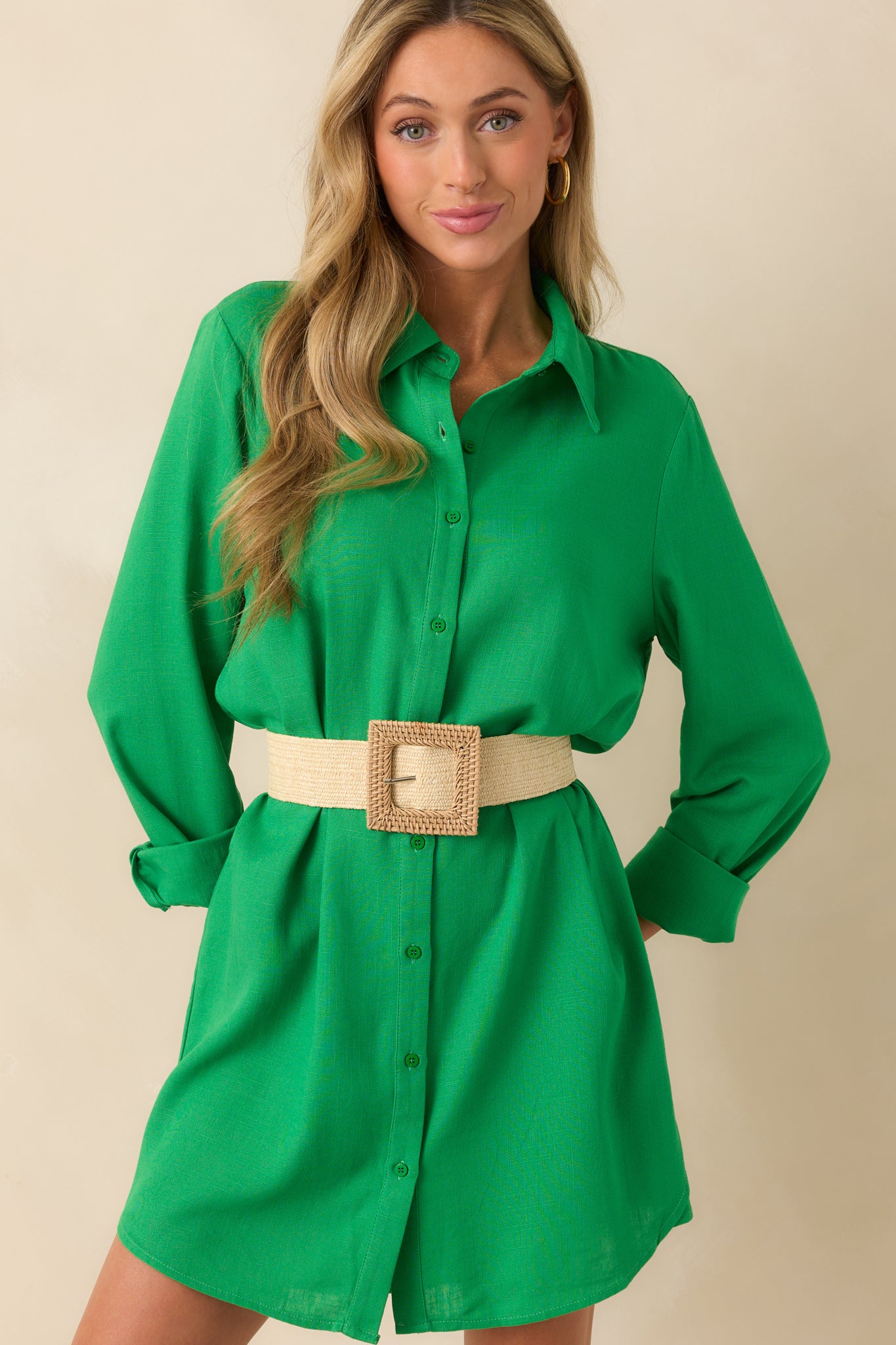 Cropped image focusing on the collared neckline and upper functional button front details.