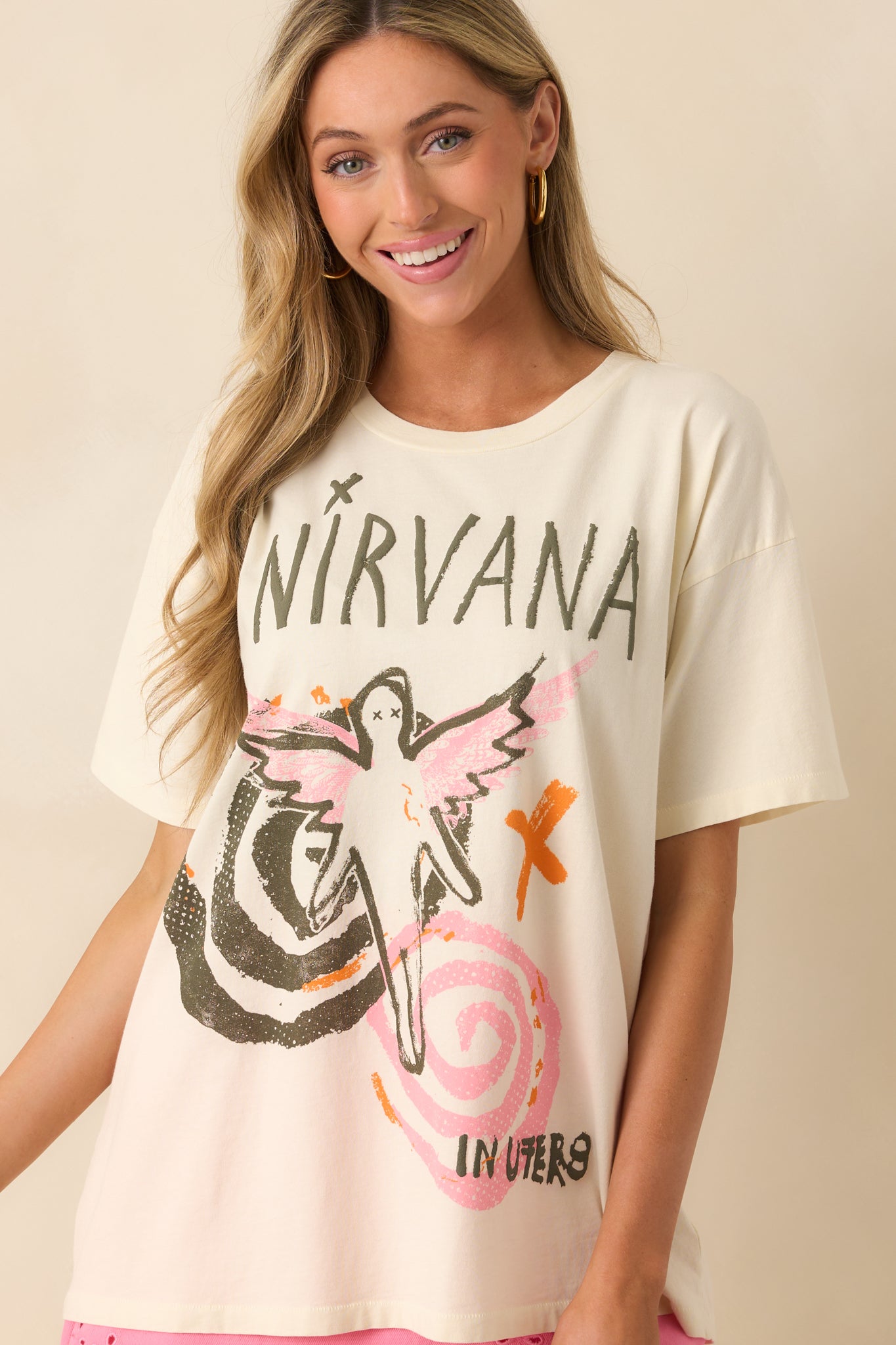 Zoomed-in view of the lower half of the tee, focusing on the fit around the waist and the relaxed hem.