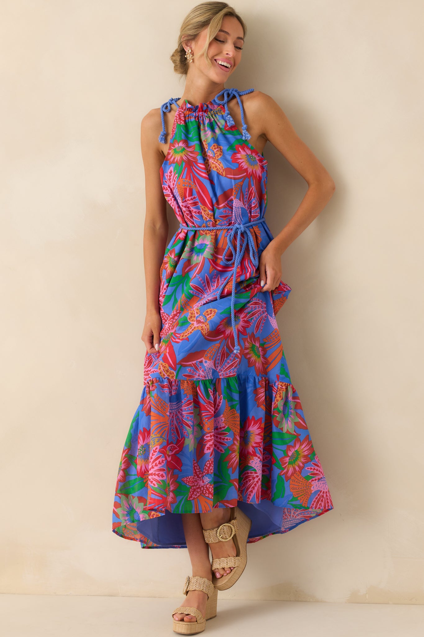 Head-to-toe shot highlighting the optional blue self-tie rope belt cinching the waist and the tropical print throughout.