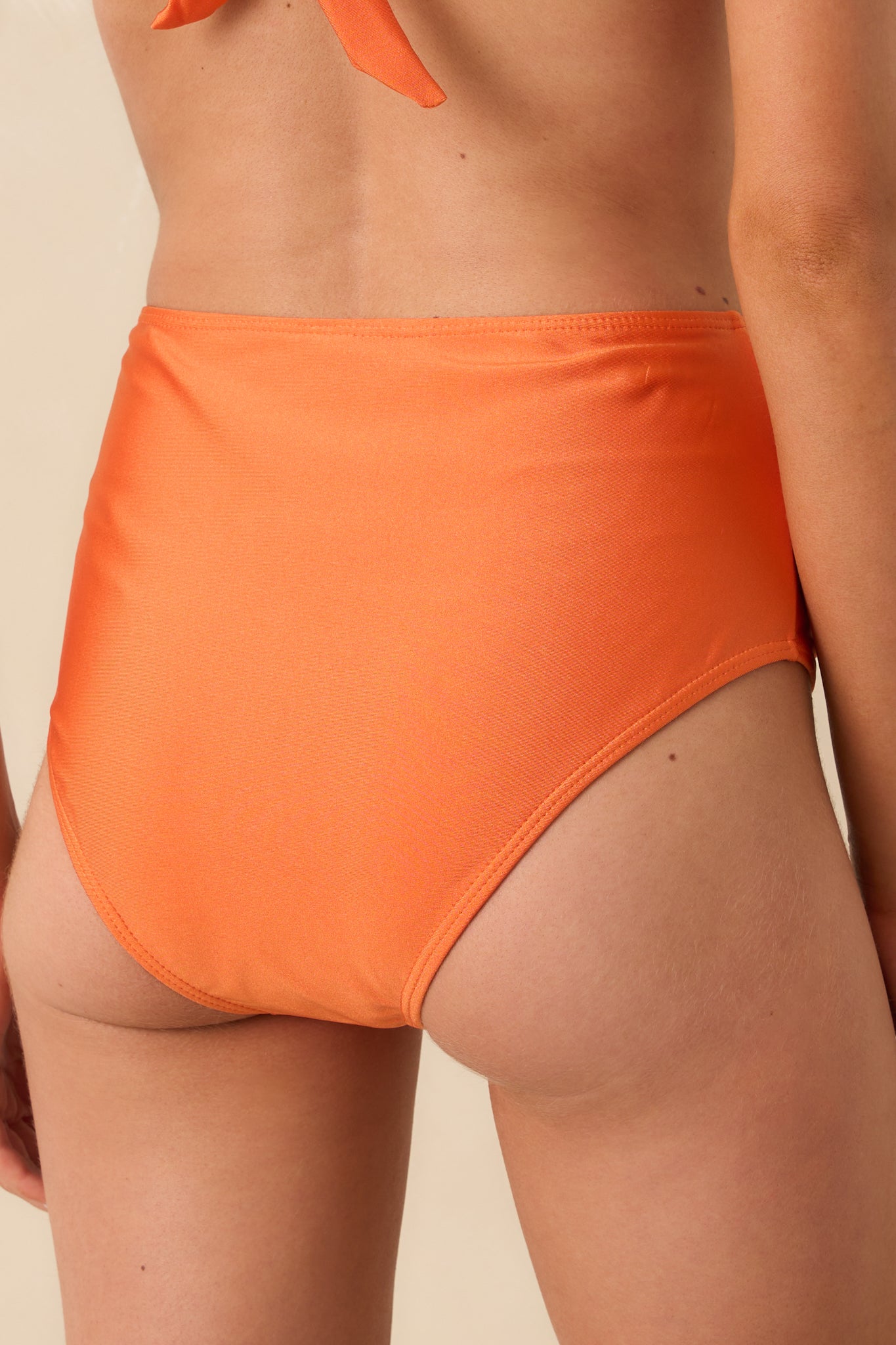 Back view of the bikini bottoms showing medium back coverage and the consistent shimmer throughout the fabric.