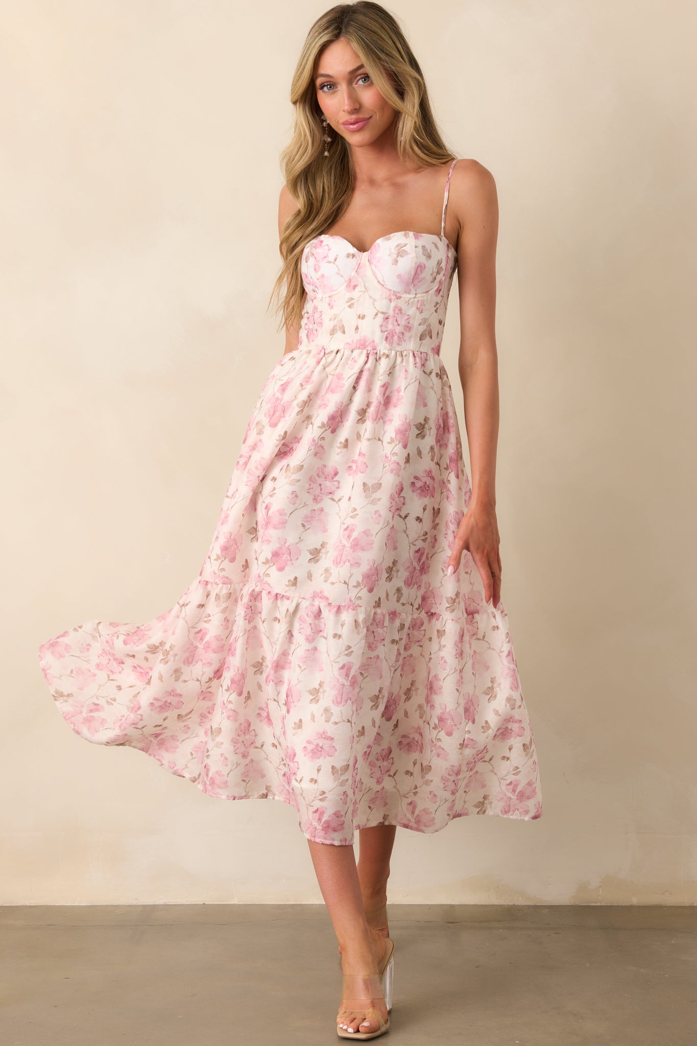 A front-facing look at a pink chiffon dress with a white lining, underwire bust, and adjustable straps.