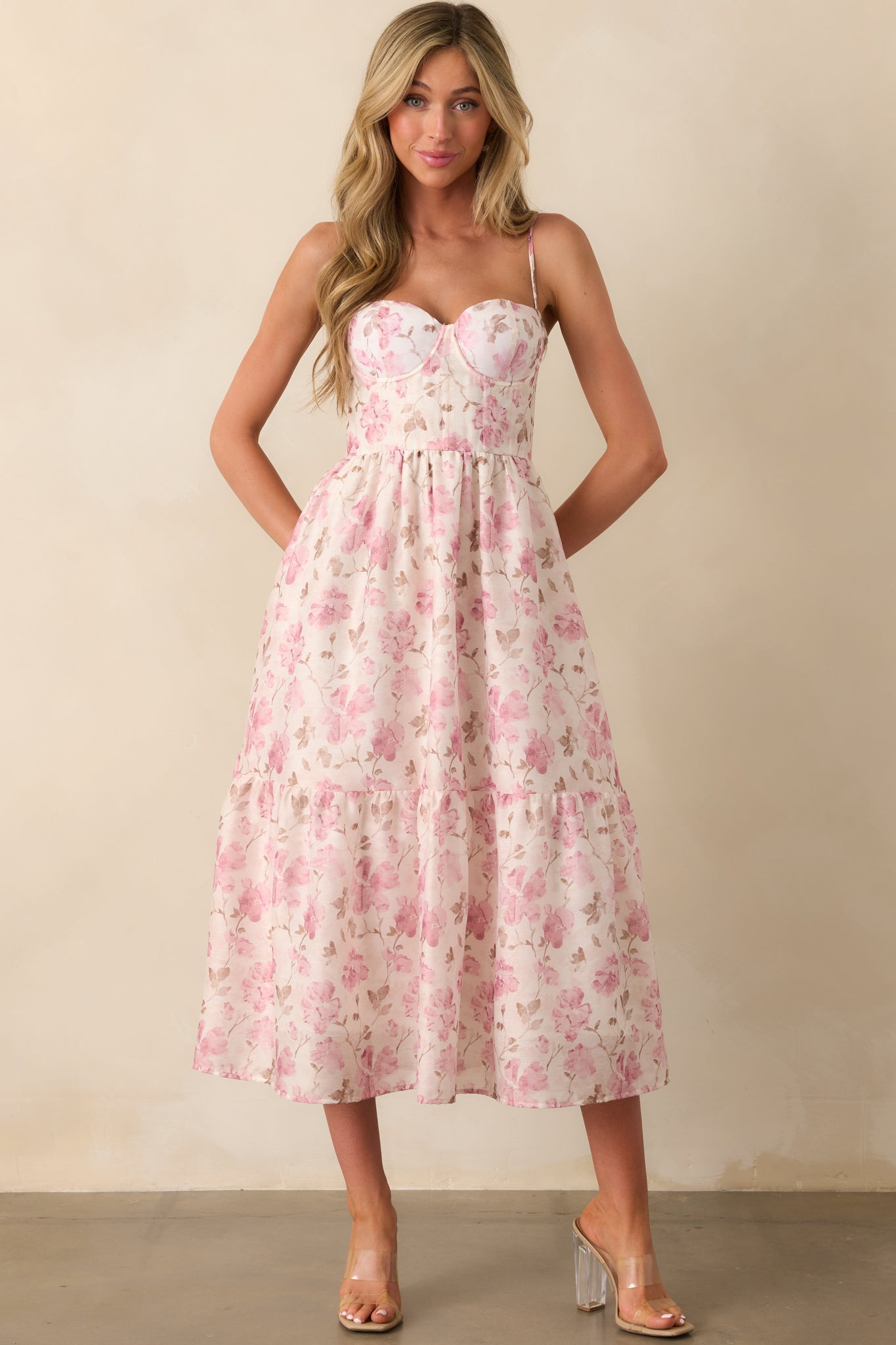 Dusty pink chiffon maxi dress with bustier-style bodice and tiered skirt shown from the front.