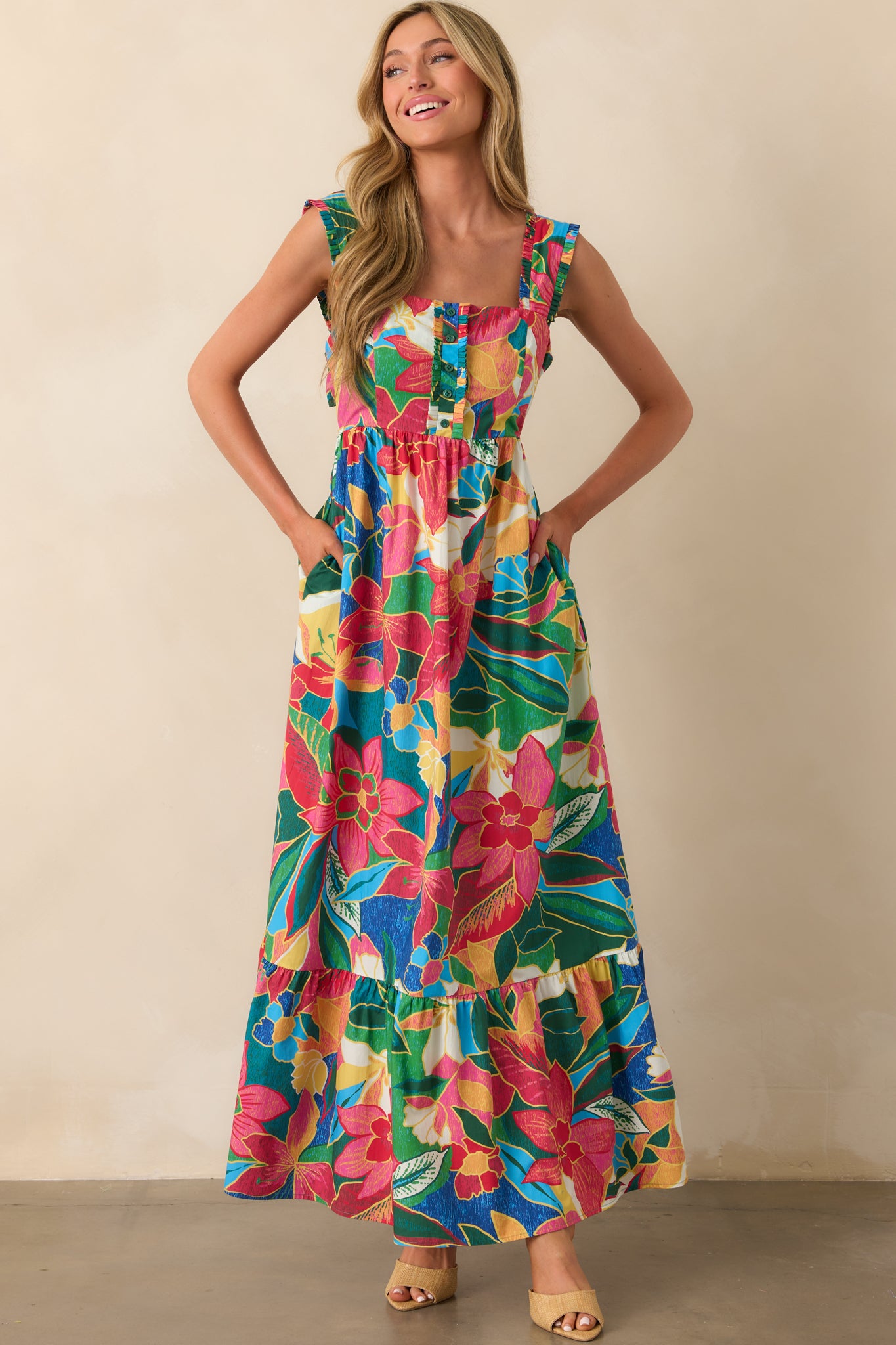Full body view emphasizing the vibrant floral pattern, structured neckline, and functional side pockets