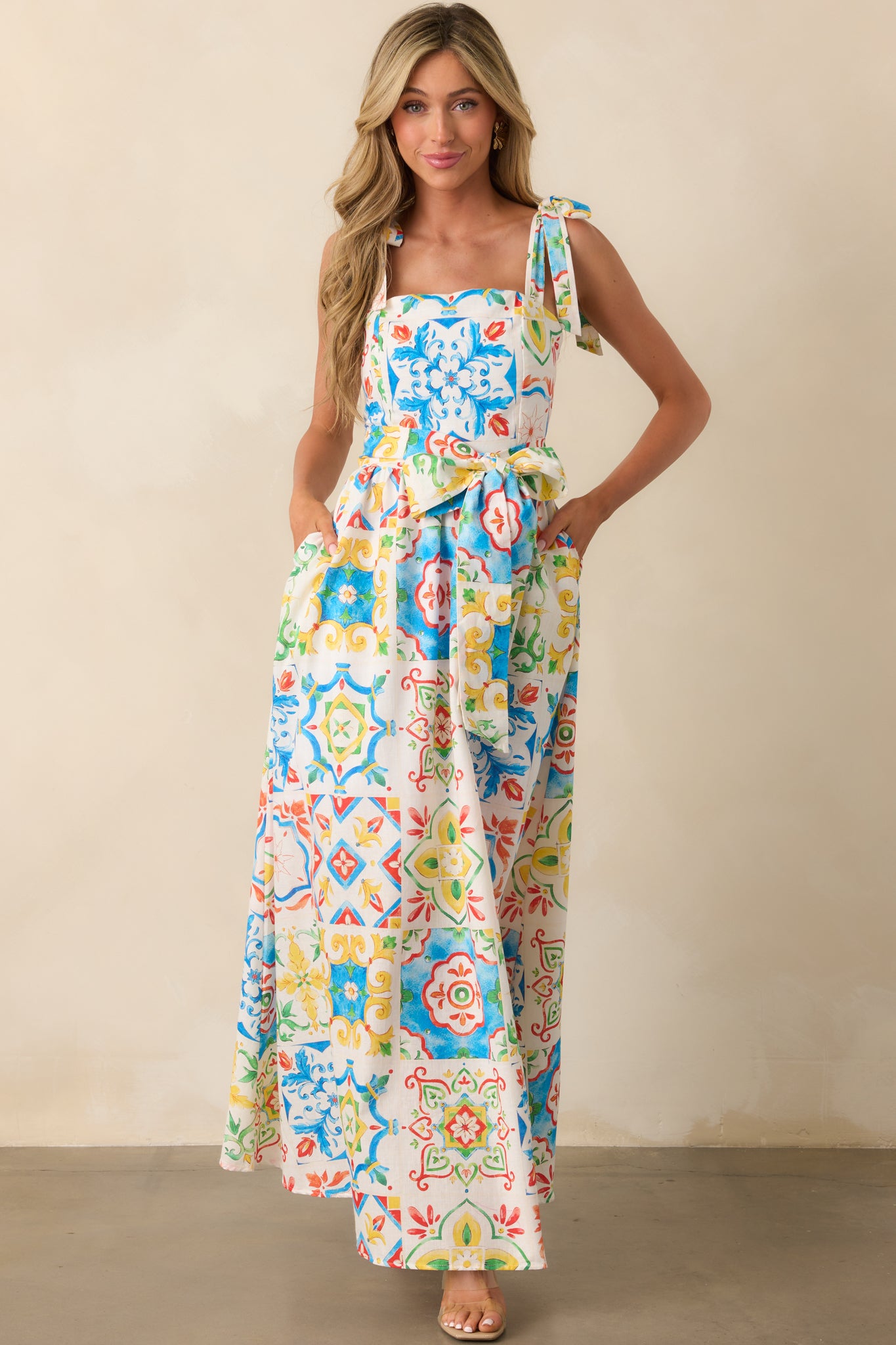 Vibrant blue multi dress with adjustable shoulder ties and a softly structured bodice.