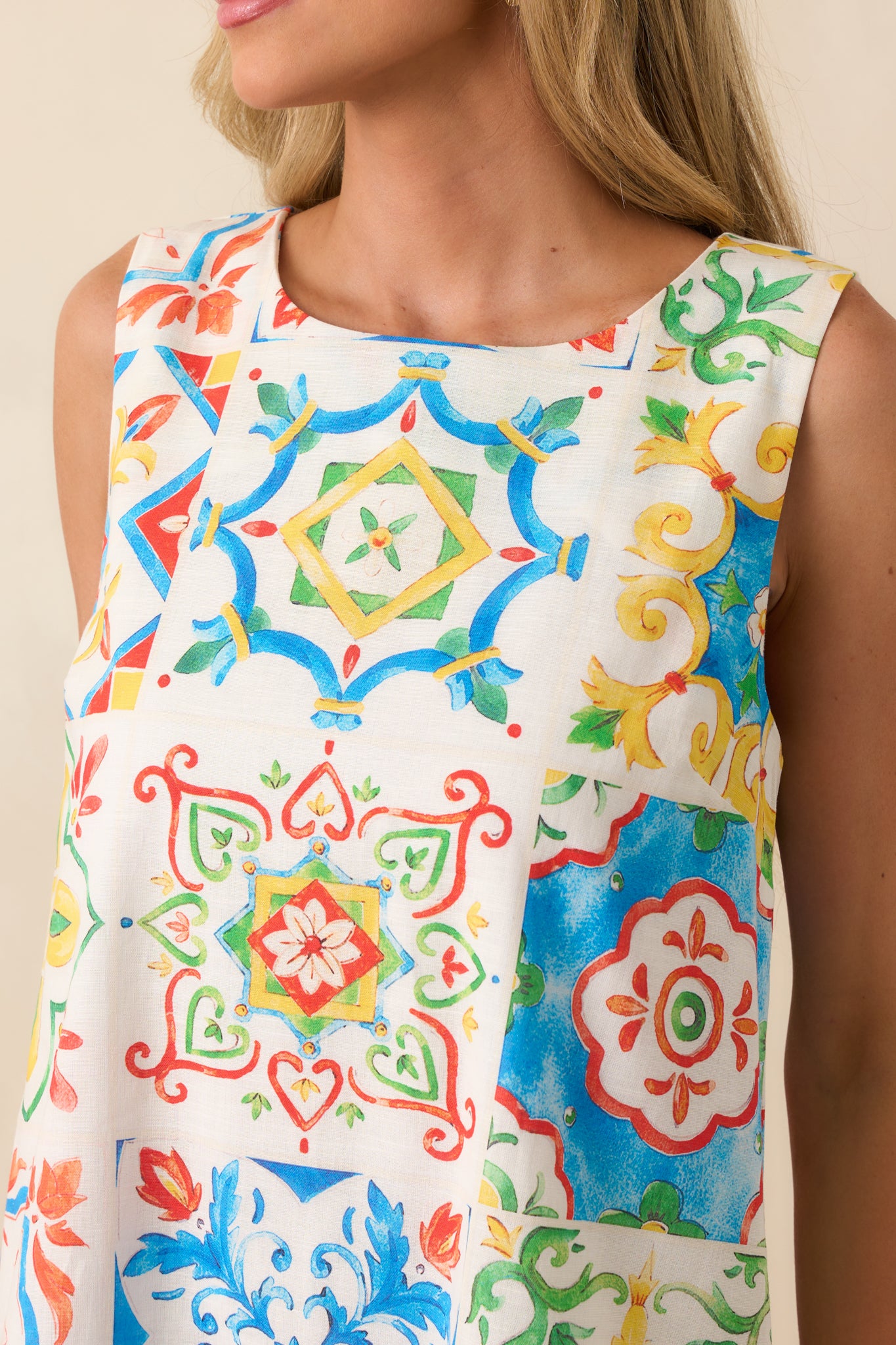 A zoomed-in image of the tile print fabric, capturing fine details of the design and the smooth texture of the dress material.