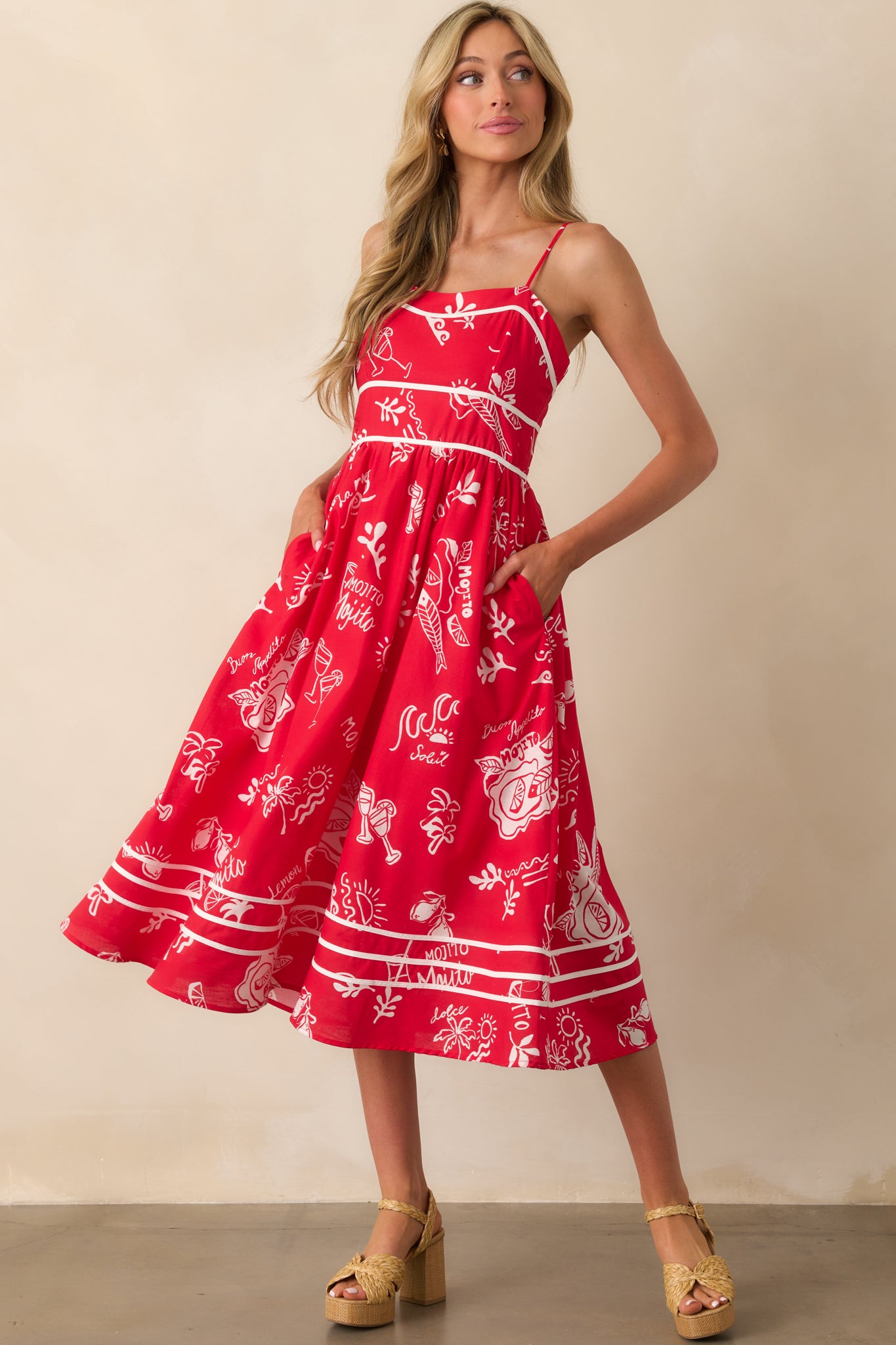 Flowy red midi dress designed with practical side pockets and an eye-catching mojito print.