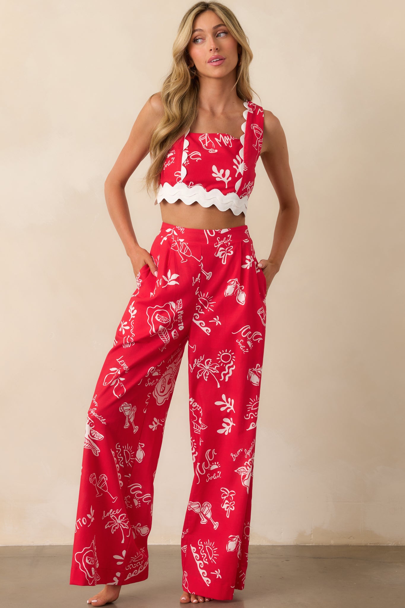Wide leg pants in a bold red tone featuring a structured front and smooth, flowing lines.