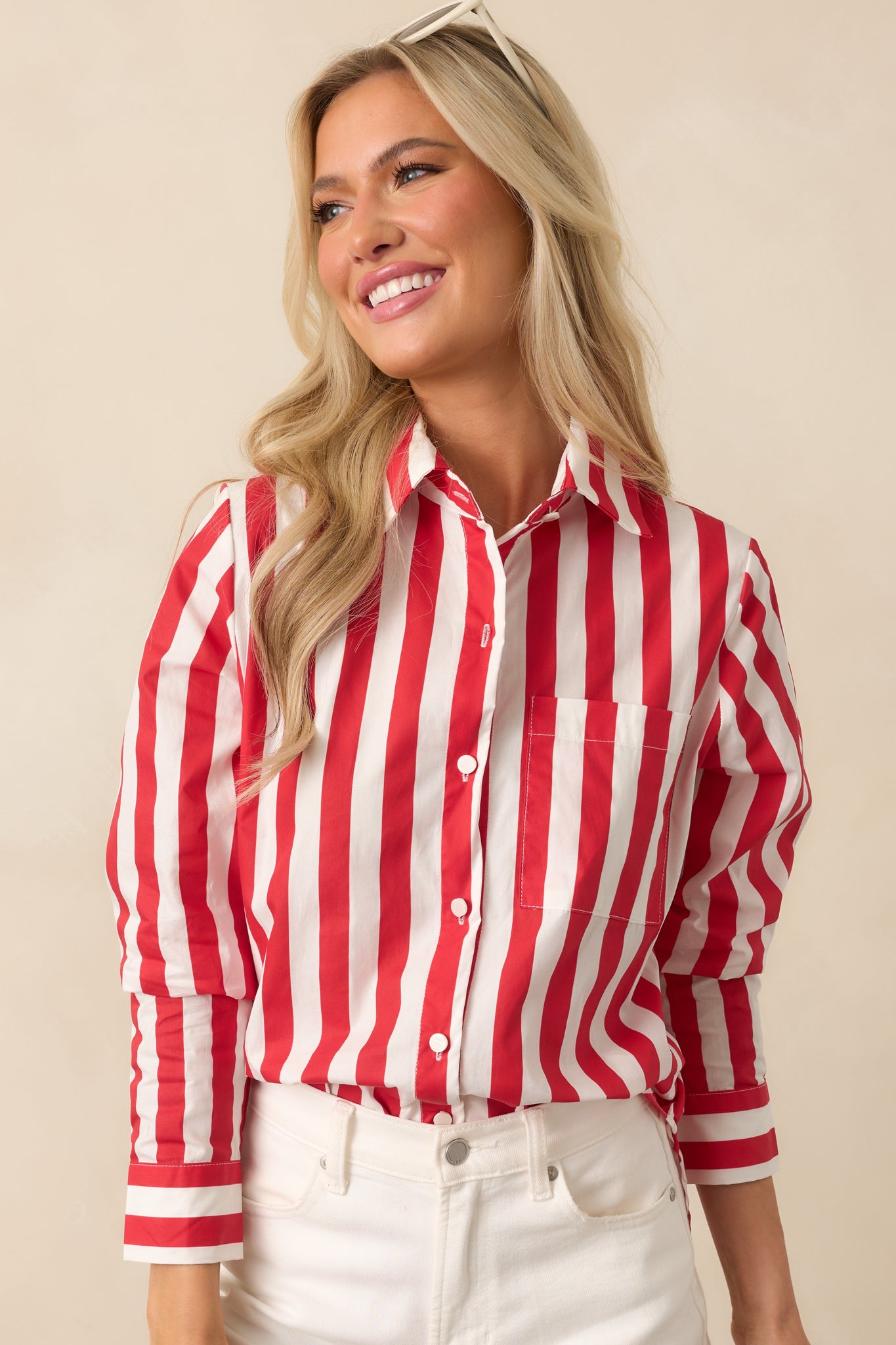 Focus on the functional breast pocket with neatly aligned red and white stripes.