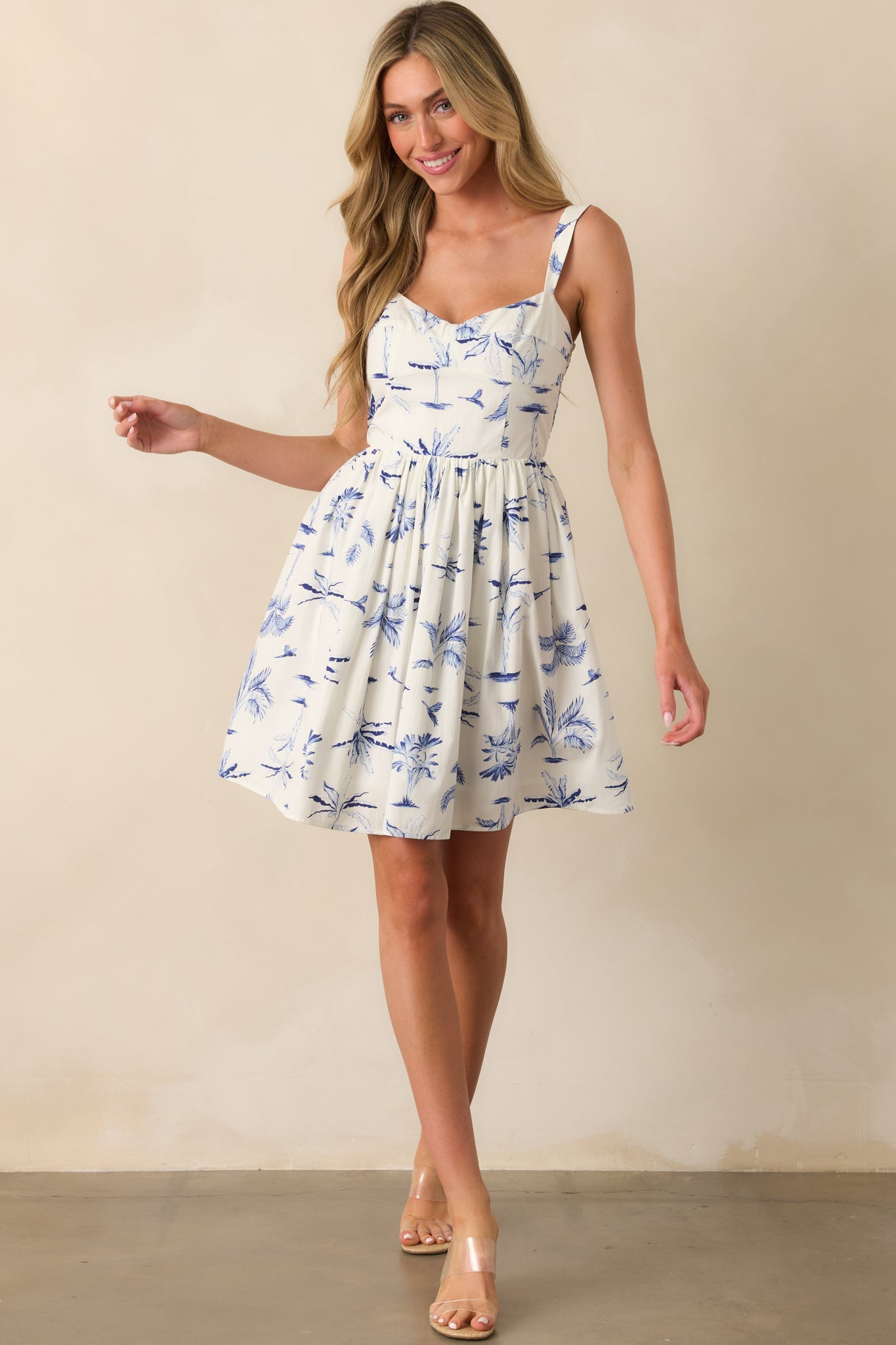 Complete front-facing look at the mini dress highlighting the panel bust design and airy silhouette.
