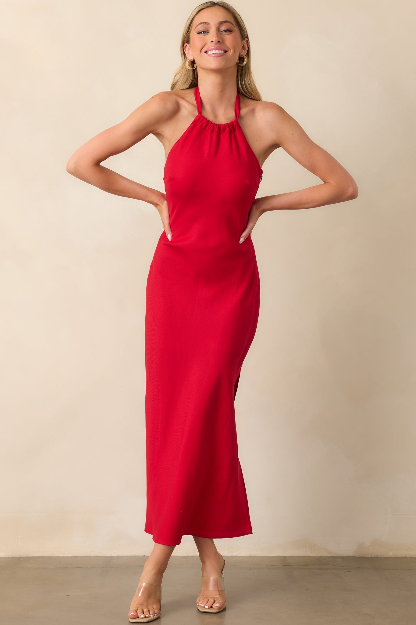 Front-facing angle emphasizing the halter neckline and how the fitted bodice shapes the upper portion of the dress.