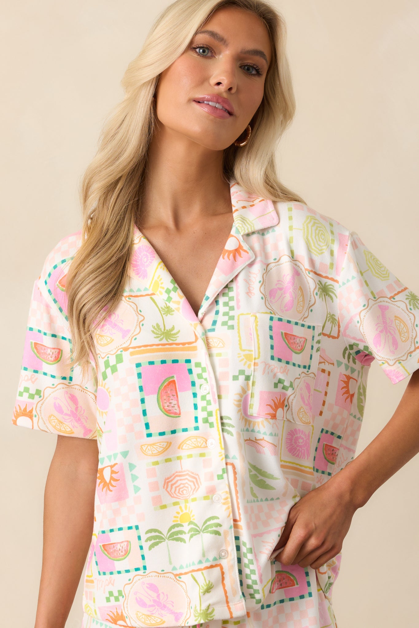 Close crop of the breast pocket and surrounding tropical print fabric.